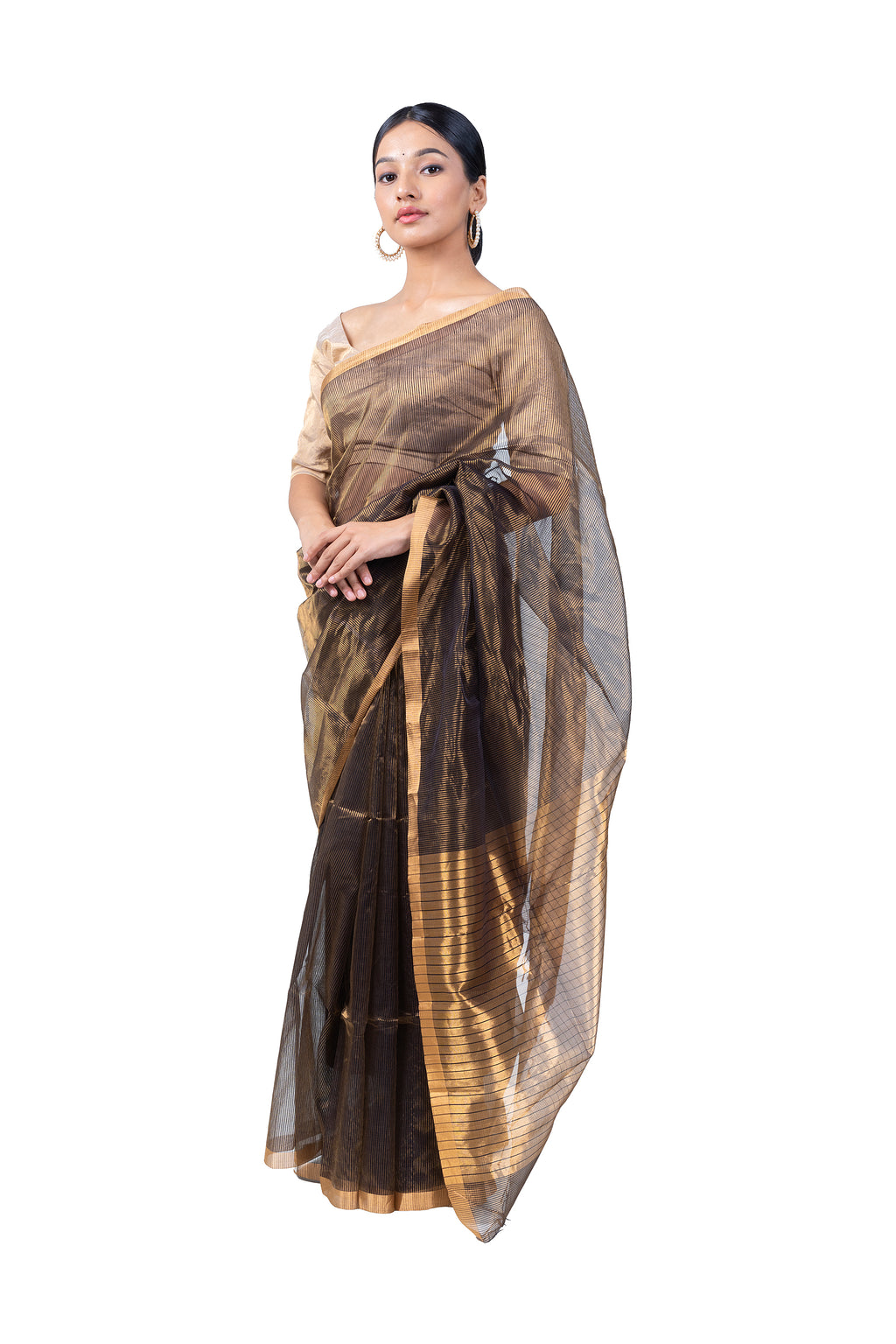 Woman wearing a black and gold saree on a white background