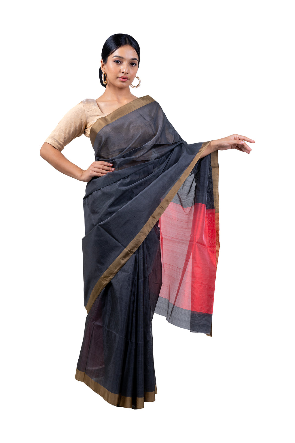 Woman wearing a traditional saree with a black and red design on a white background