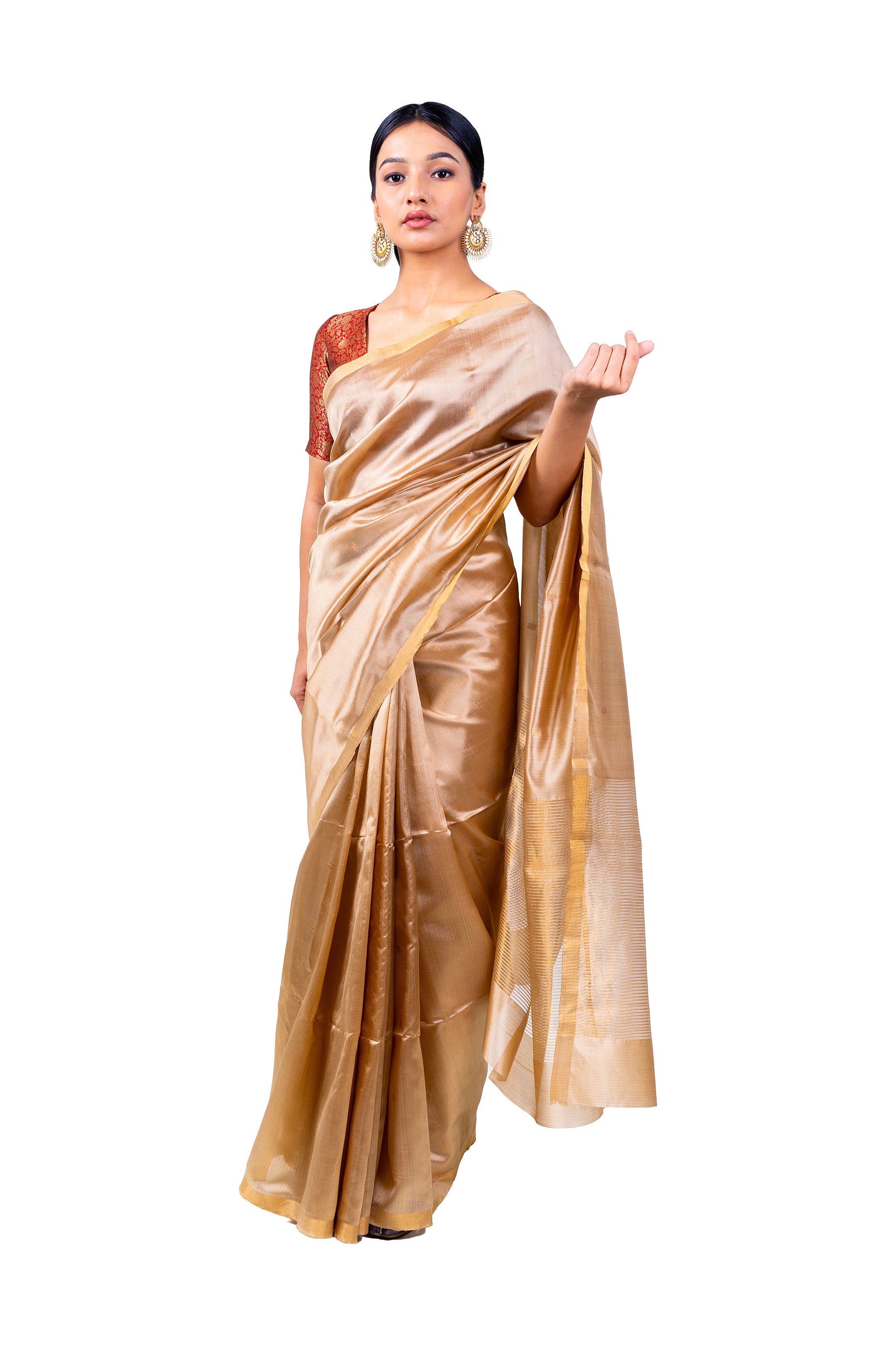 Woman wearing a beige saree with a white background