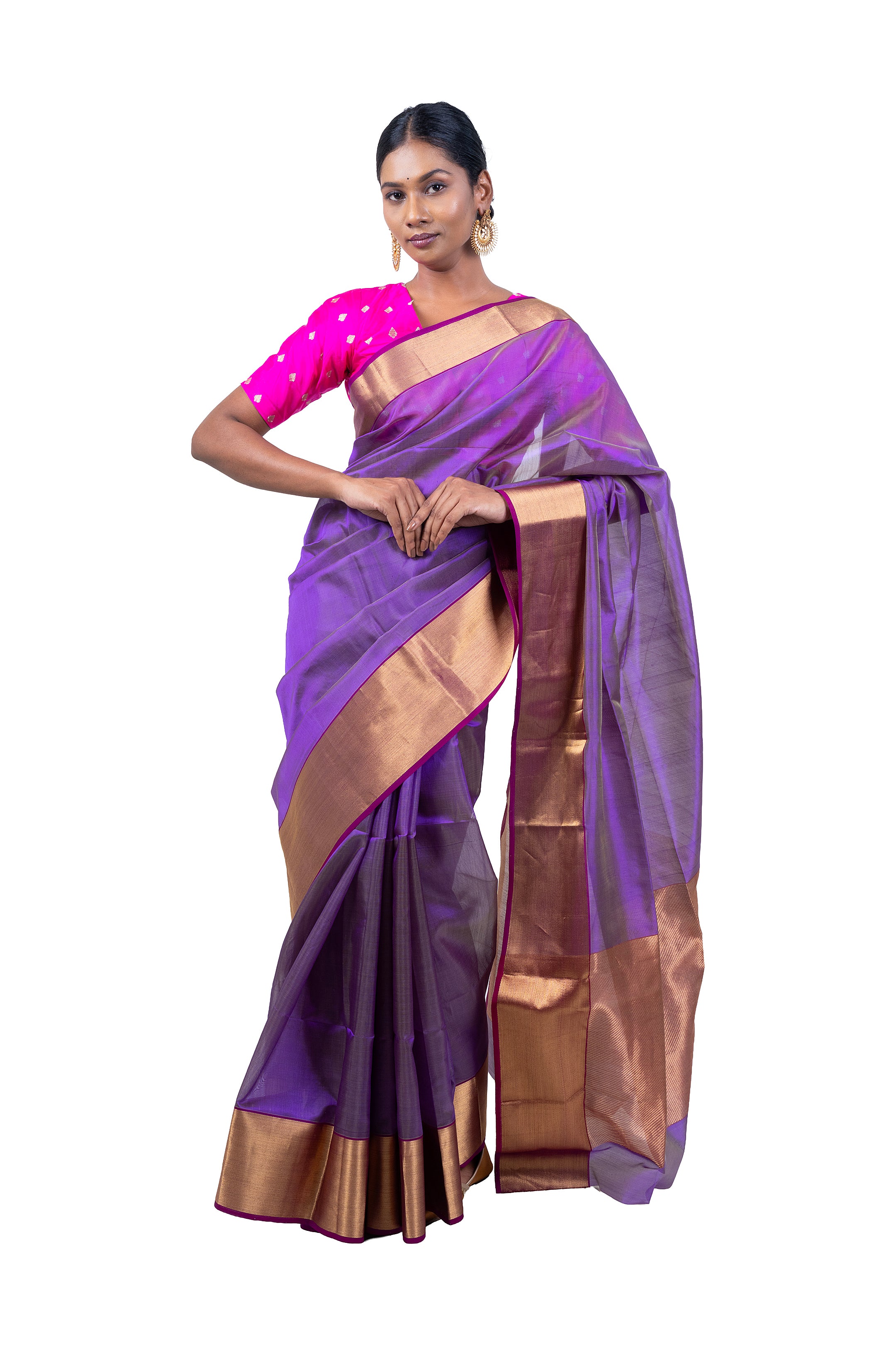 Woman wearing a purple saree with gold border on a white background