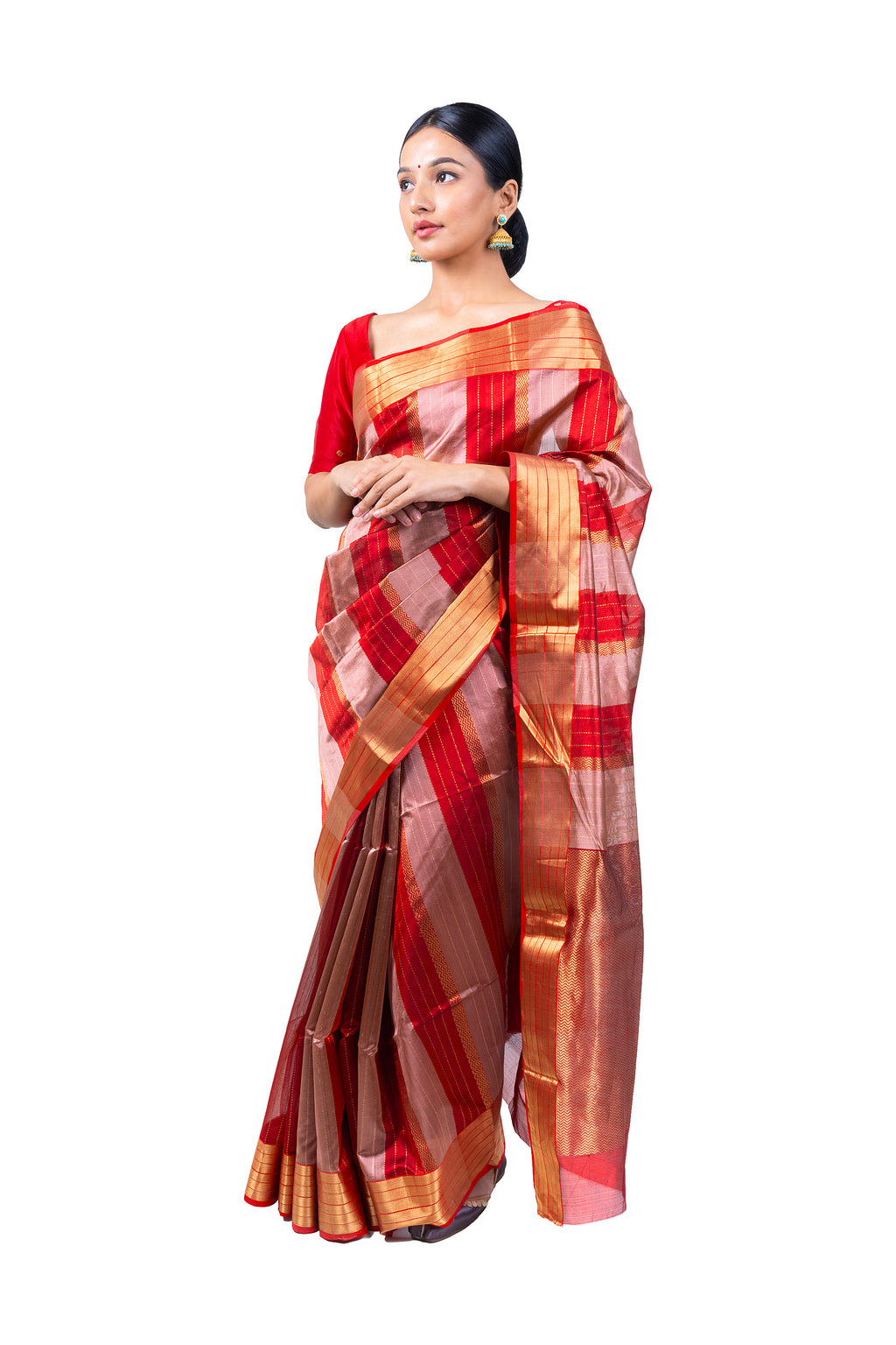 Woman wearing a red and gold saree on a white background