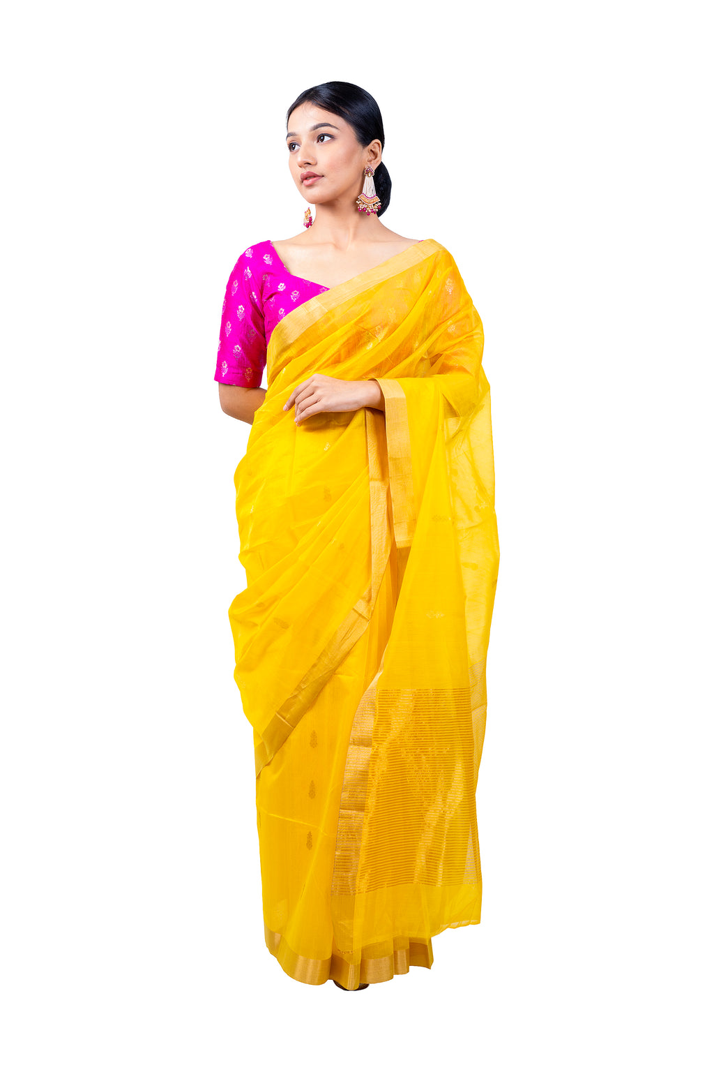 Woman wearing a yellow saree with a pink blouse on a white background