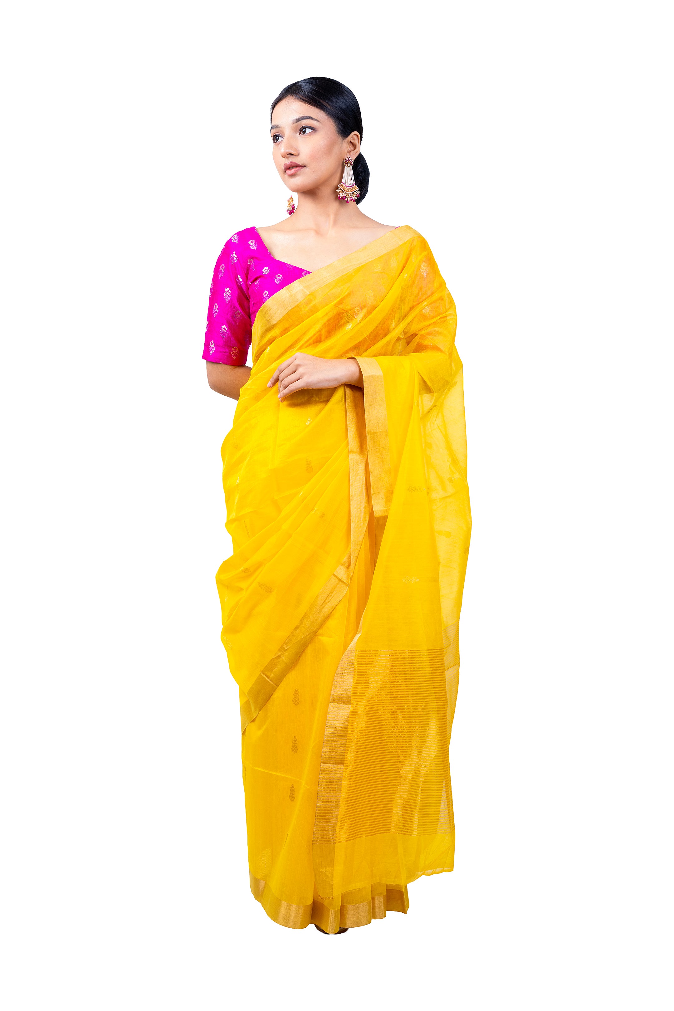 Woman wearing a yellow saree with a pink blouse on a white background