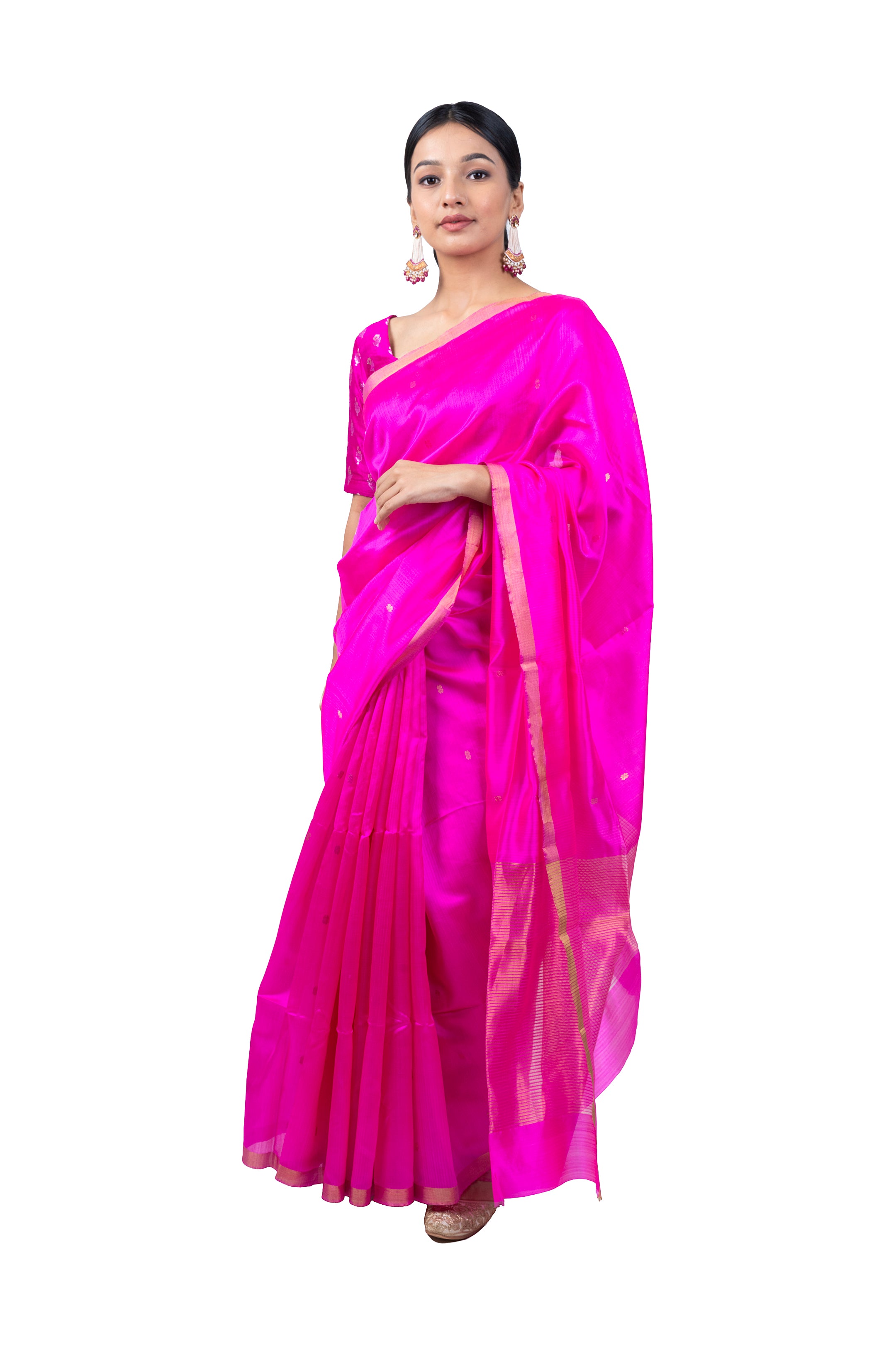 Woman wearing a bright pink saree with a white background
