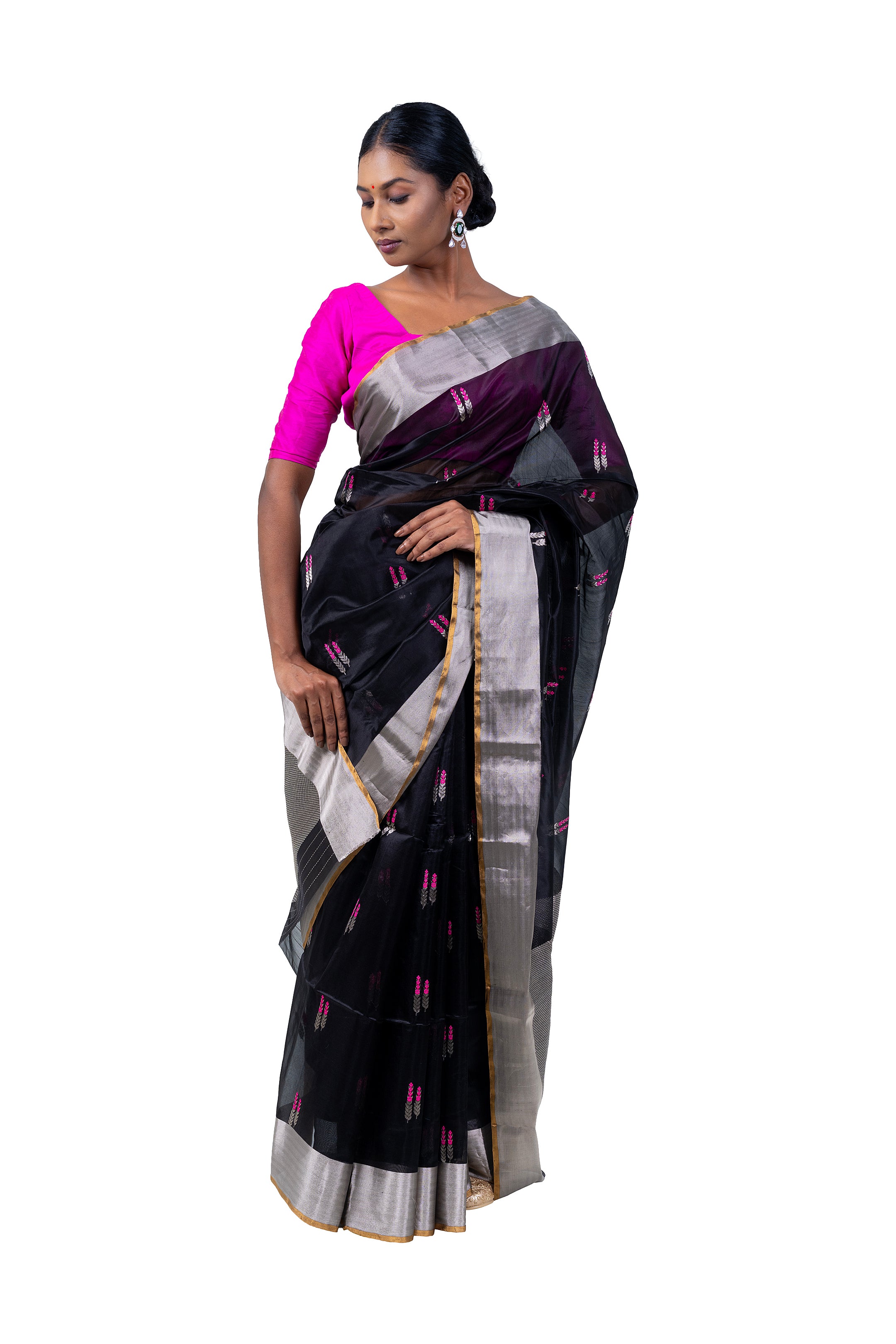 Woman wearing a black saree with a pink blouse on a white background