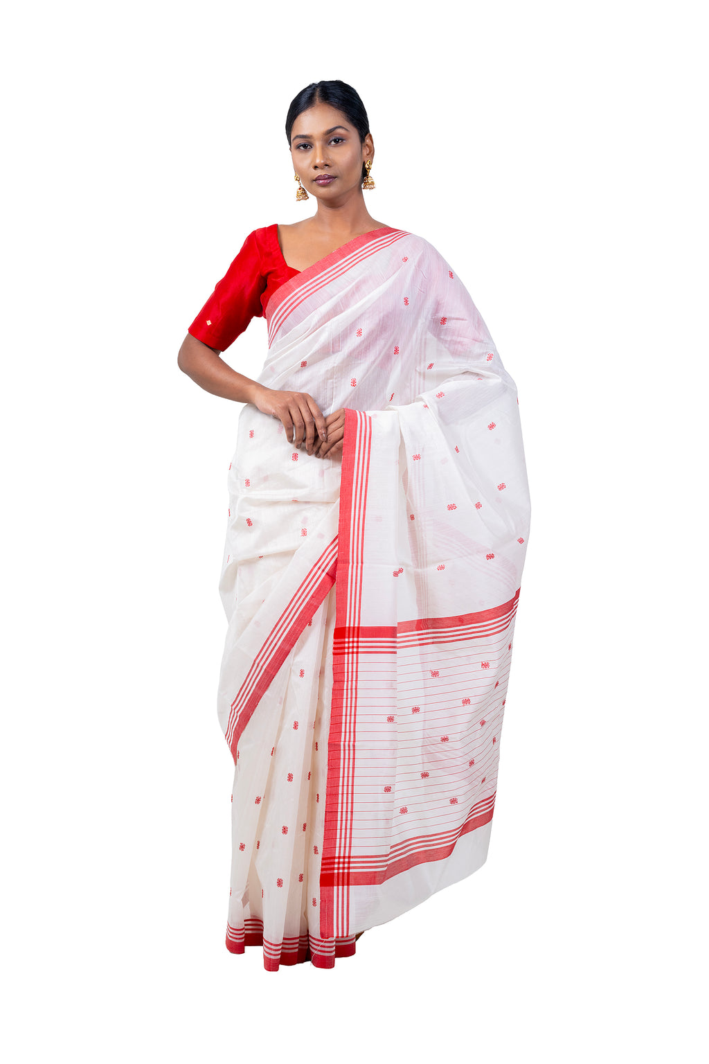 Woman wearing a white saree with red border and blouse on a white background