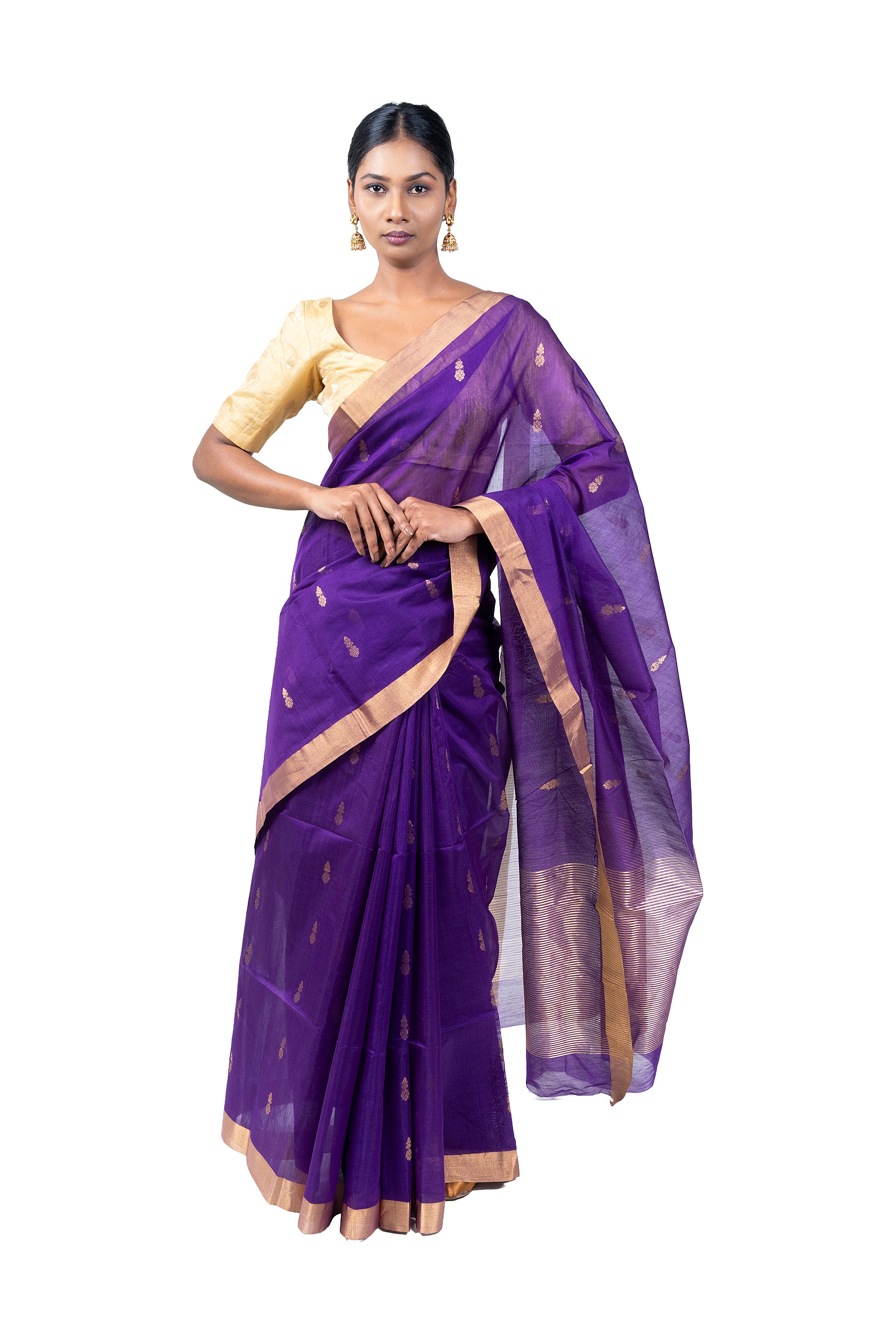Woman wearing a purple saree with a white background