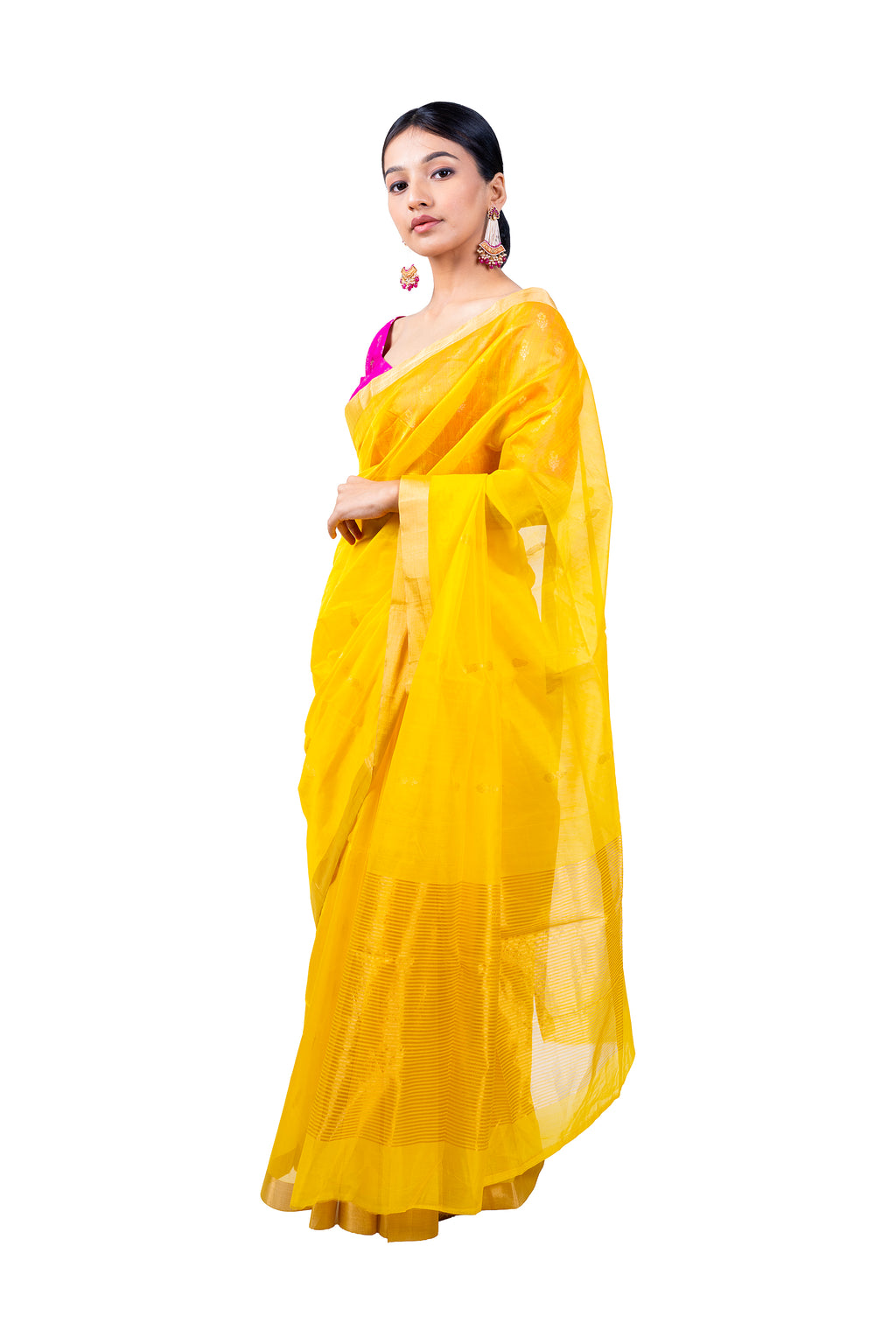 Woman wearing a yellow saree with a white background