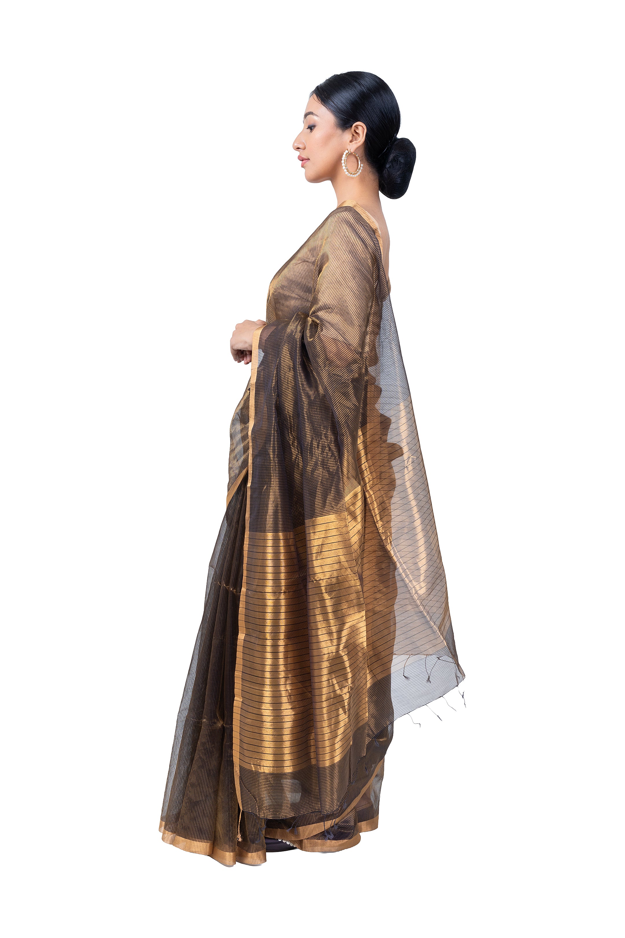 Woman wearing a traditional saree with a white background