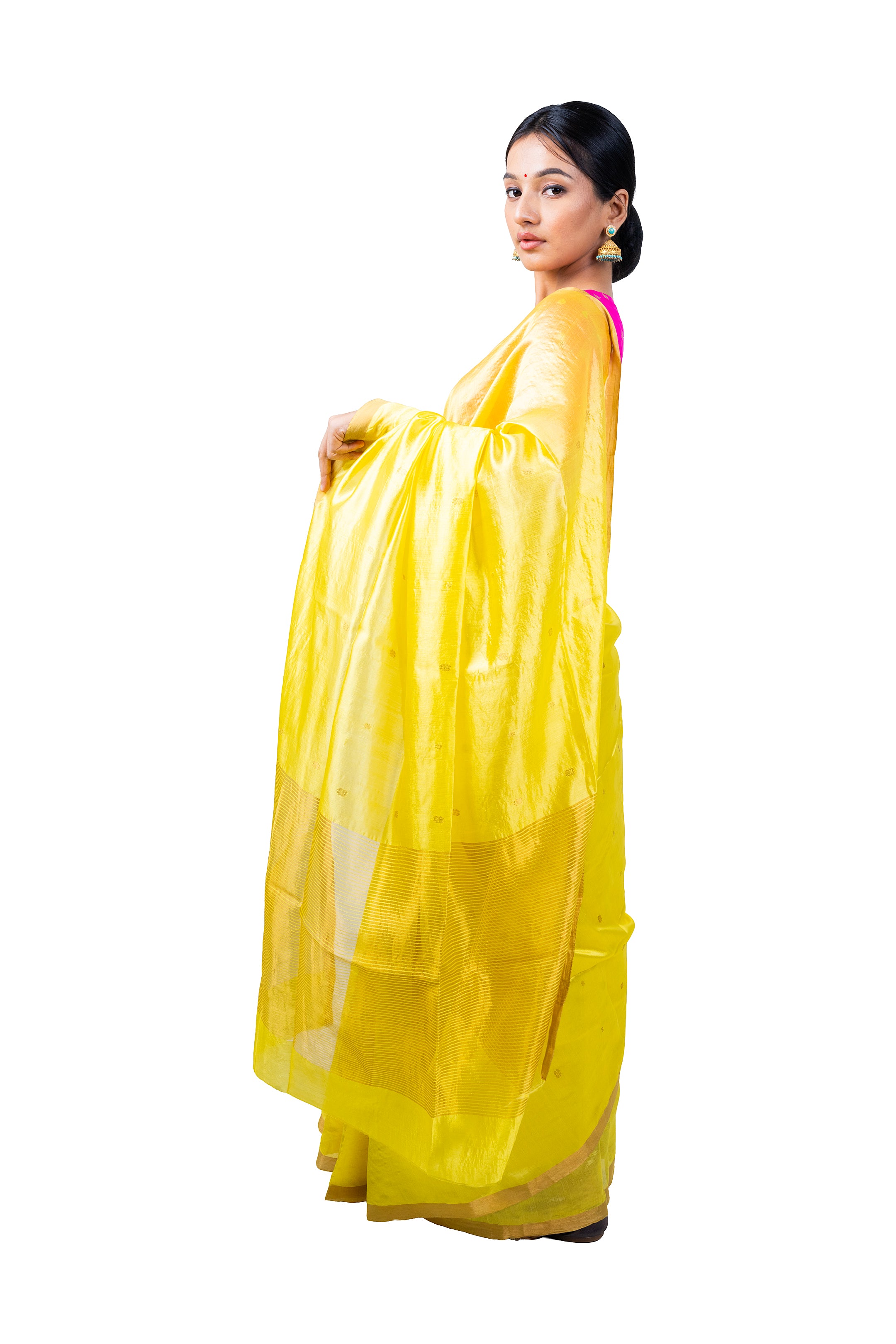 Woman wearing a bright yellow saree with a white background