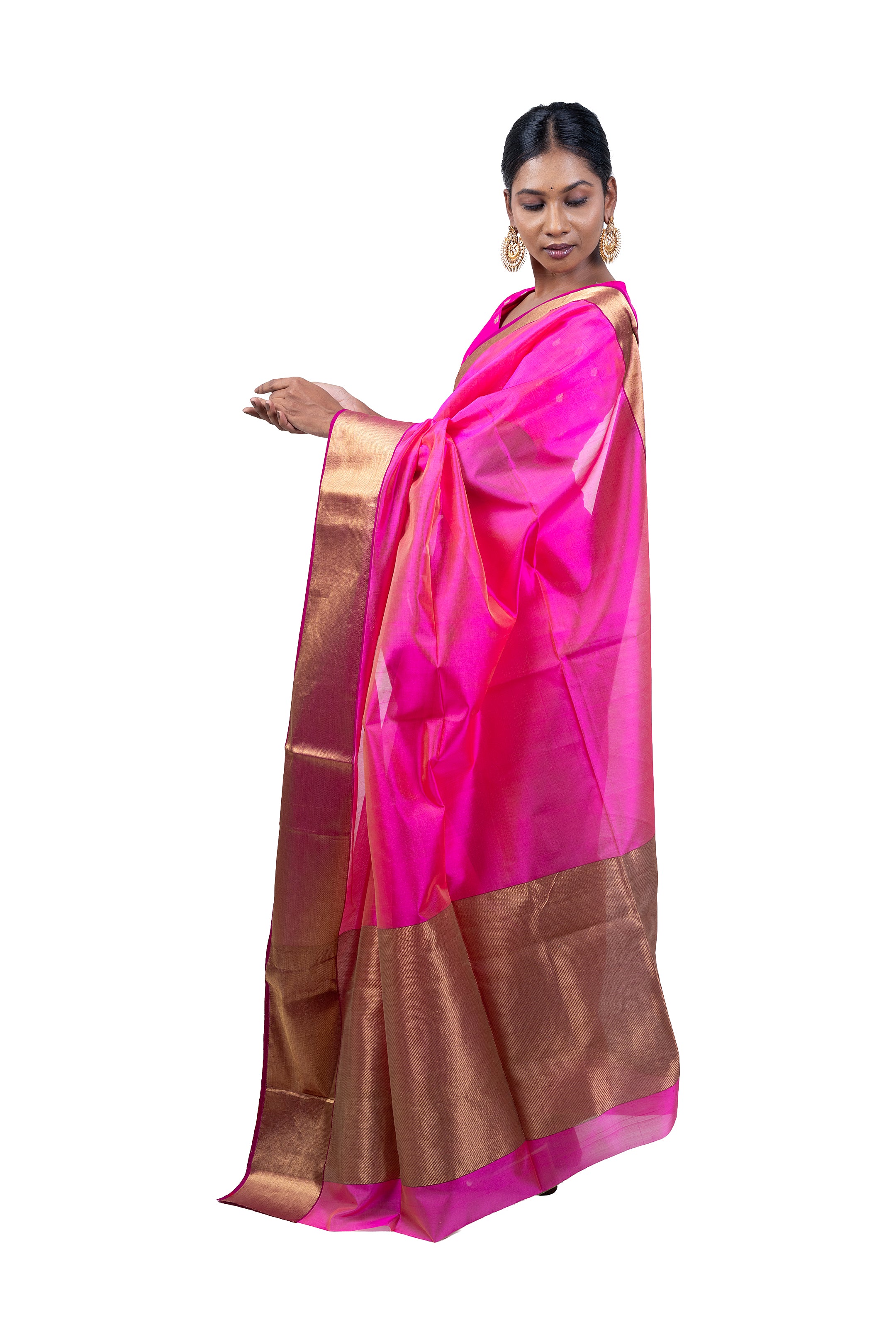 Woman wearing a pink and brown saree on a white background