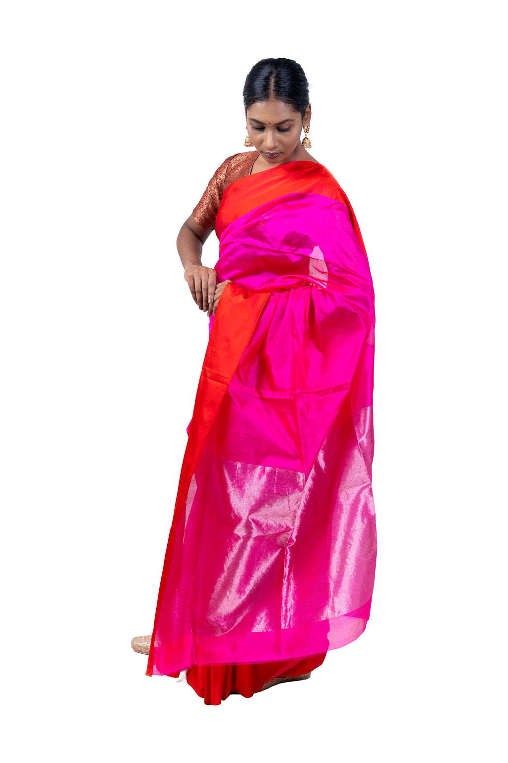 Woman wearing a pink and orange saree on a white background