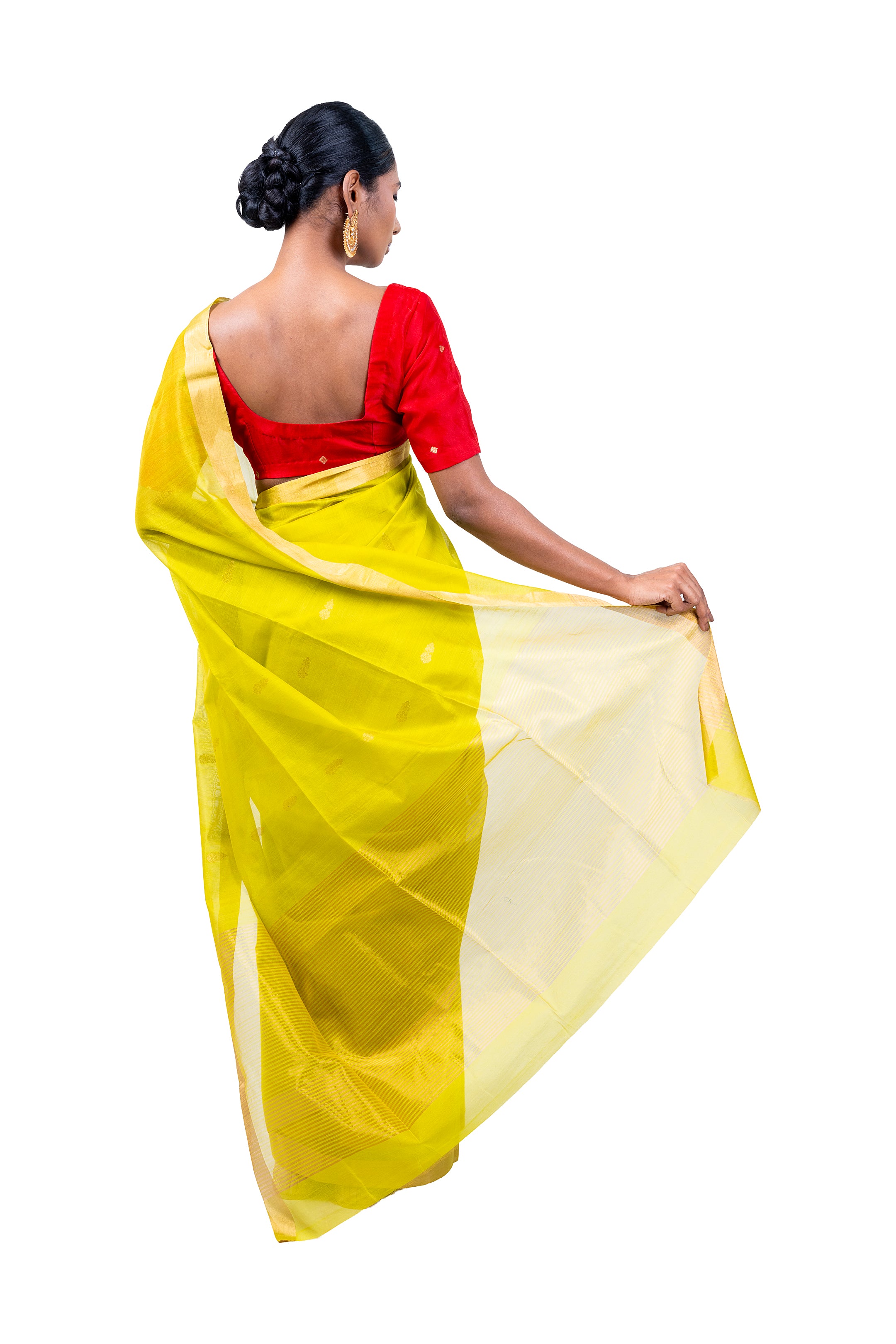 Woman wearing a yellow saree with a red blouse on a white background