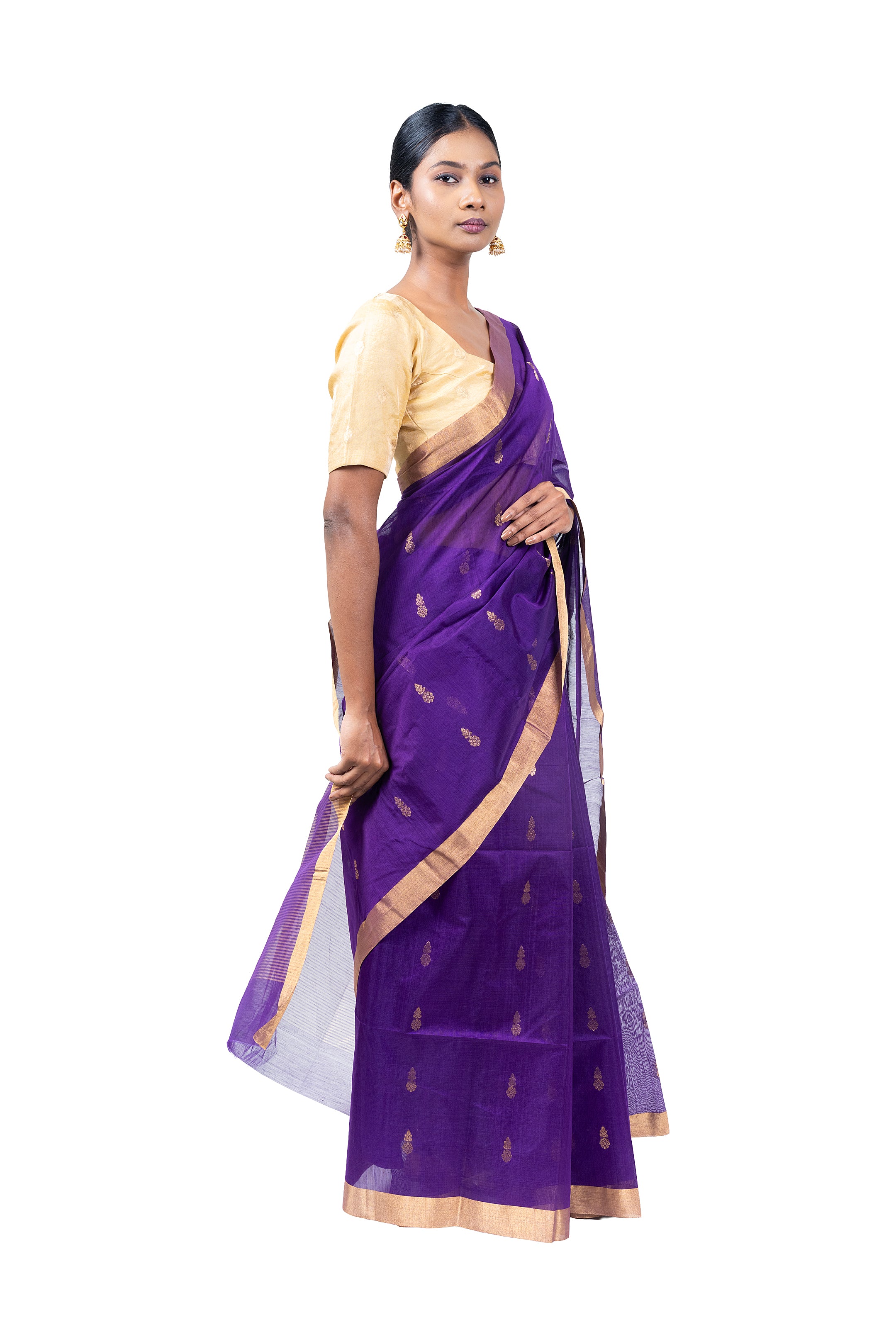 Woman wearing a purple saree with a white background