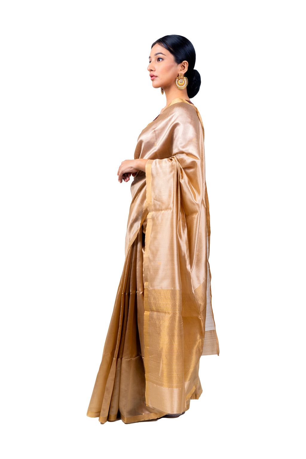 Woman wearing a gold saree on a white background
