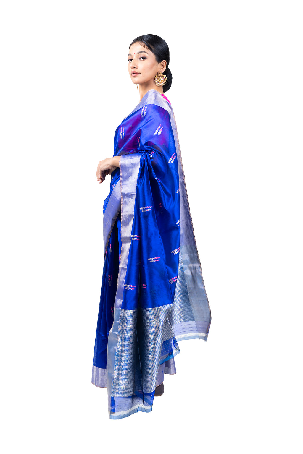 Woman wearing a blue and silver saree on a white background