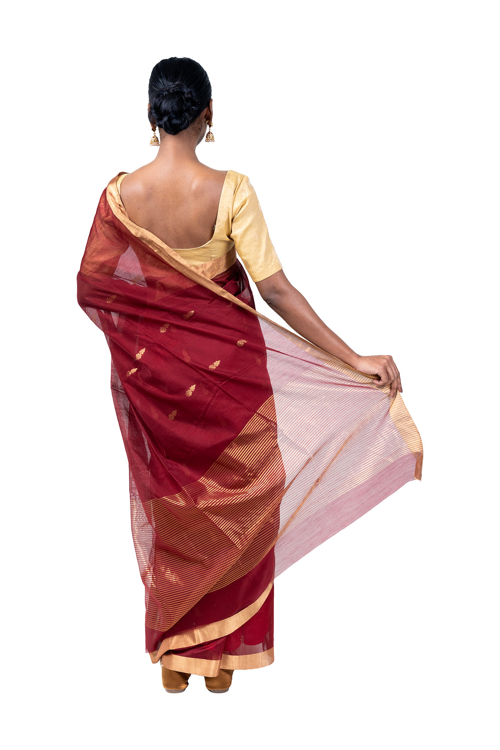 Woman wearing a traditional saree with a white background