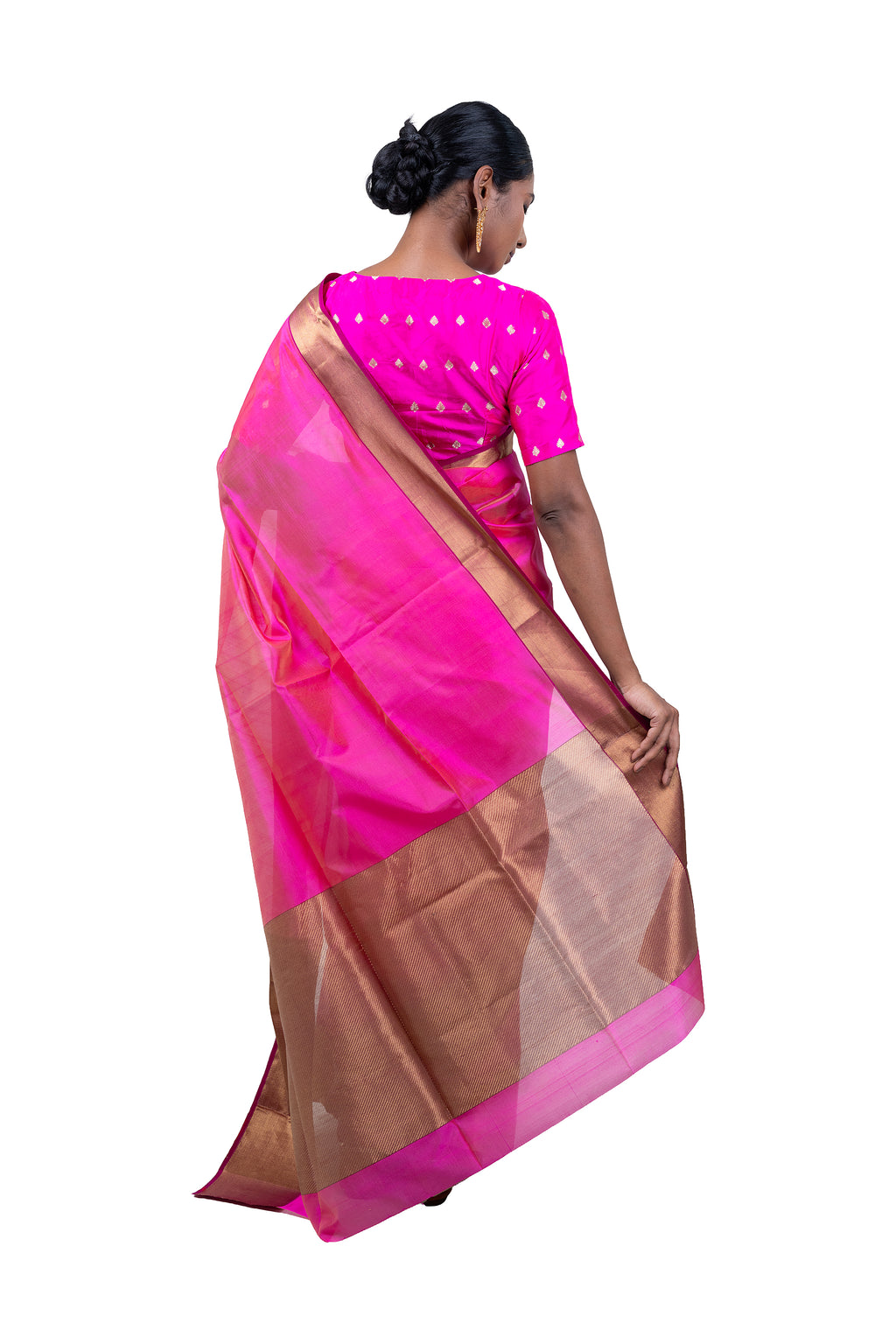 Woman wearing a pink and brown saree on a white background