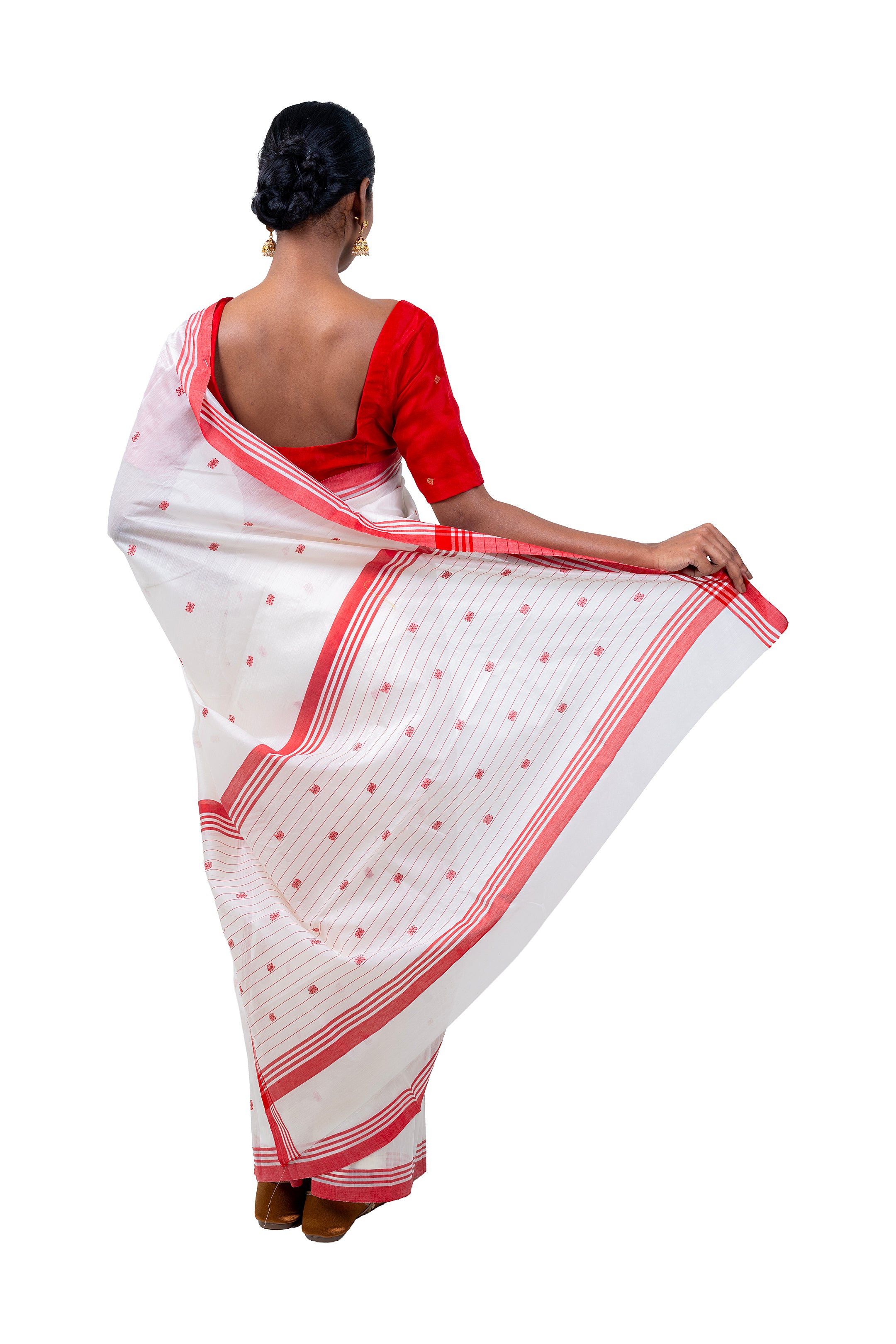 Woman wearing a white saree with red border and blouse on a white background