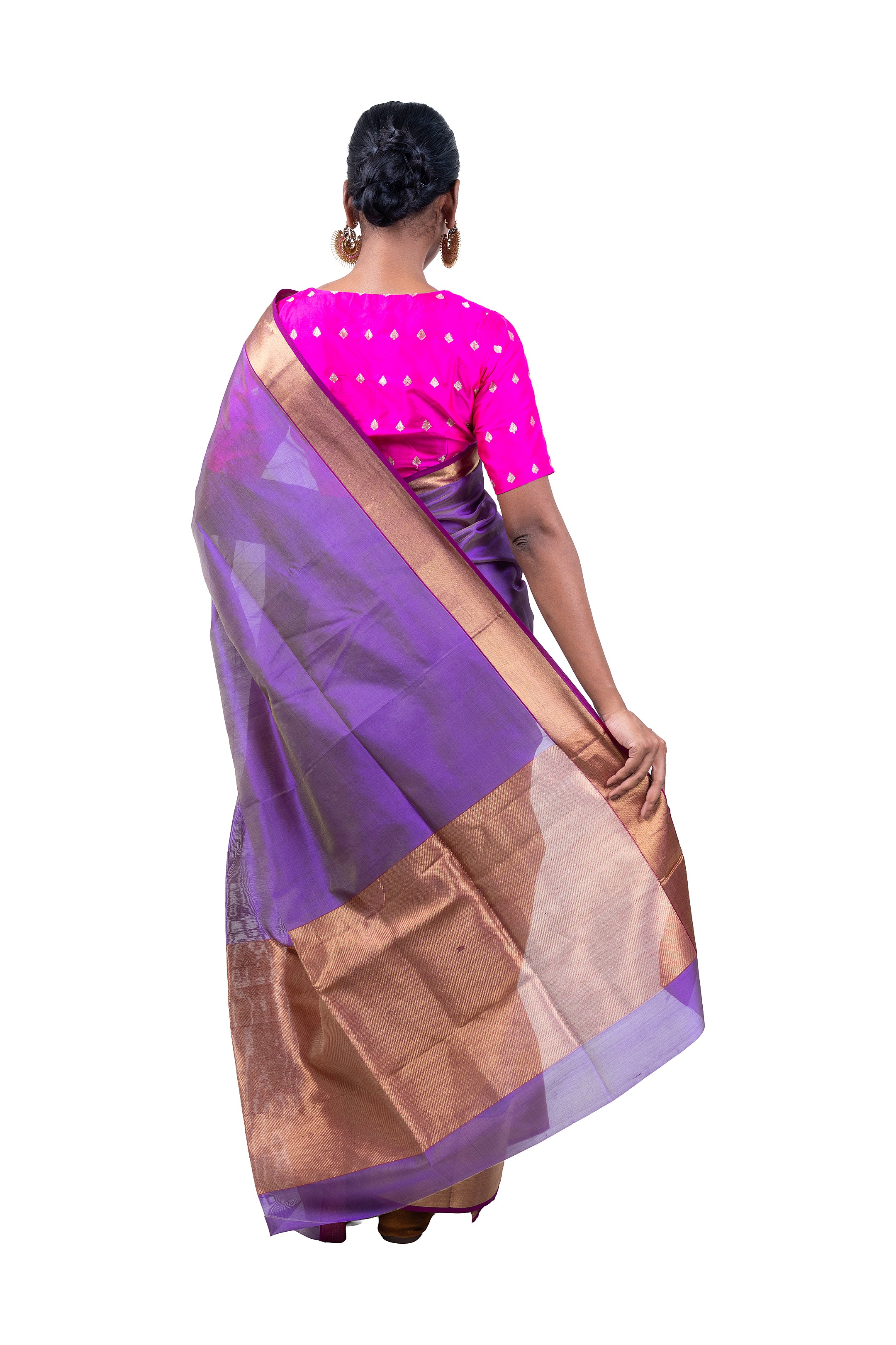 Woman wearing a purple saree with a pink blouse on a white background