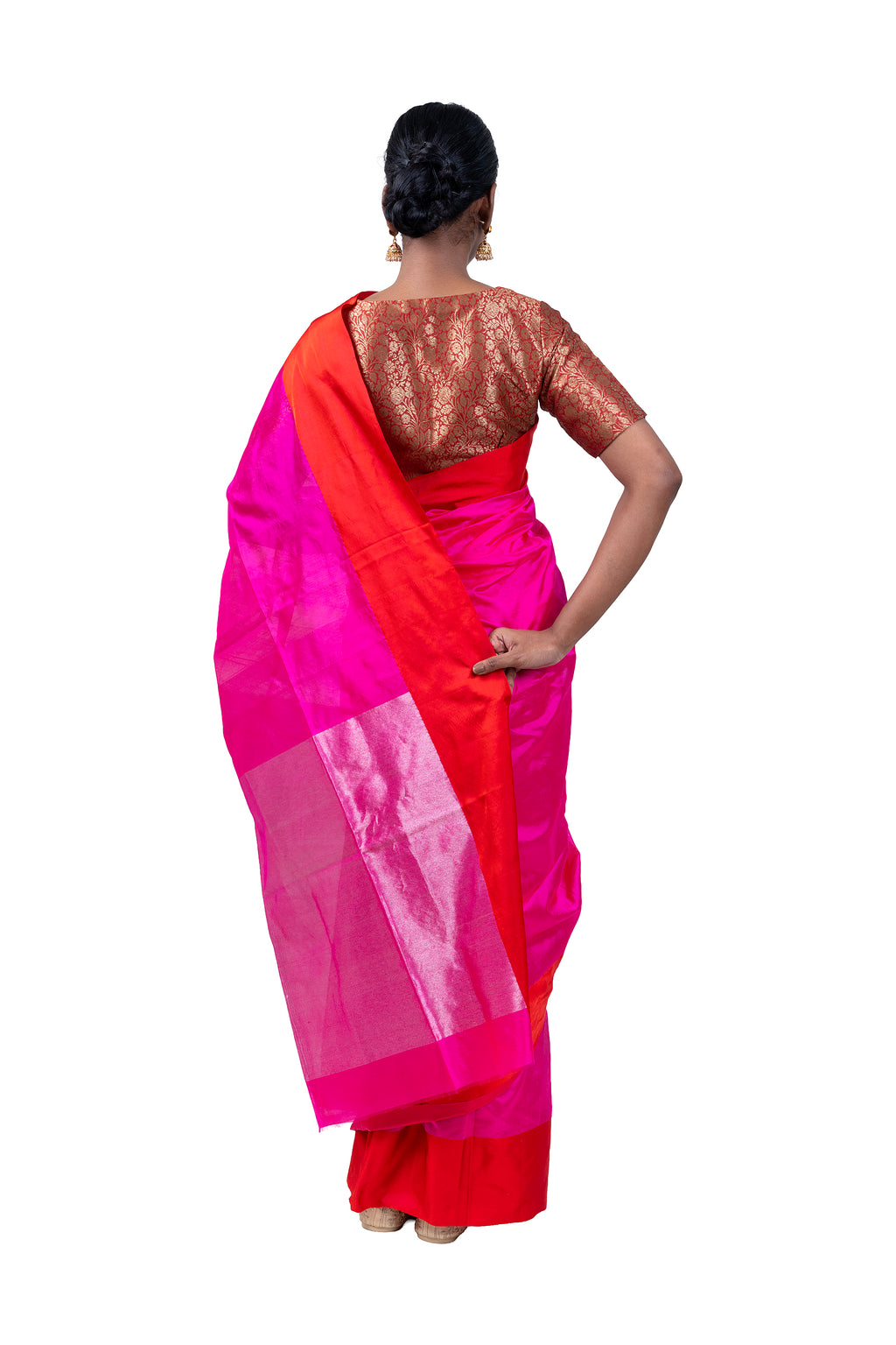 Woman wearing a pink and orange saree on a white background