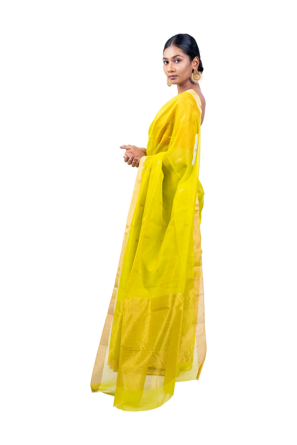 Woman wearing a bright yellow saree with a white background