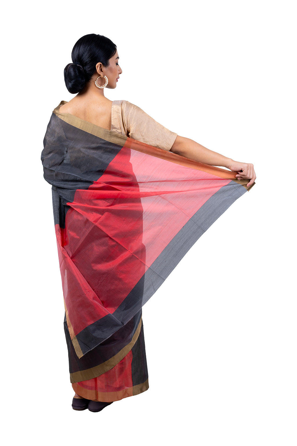 Woman holding a red and black saree with a white background