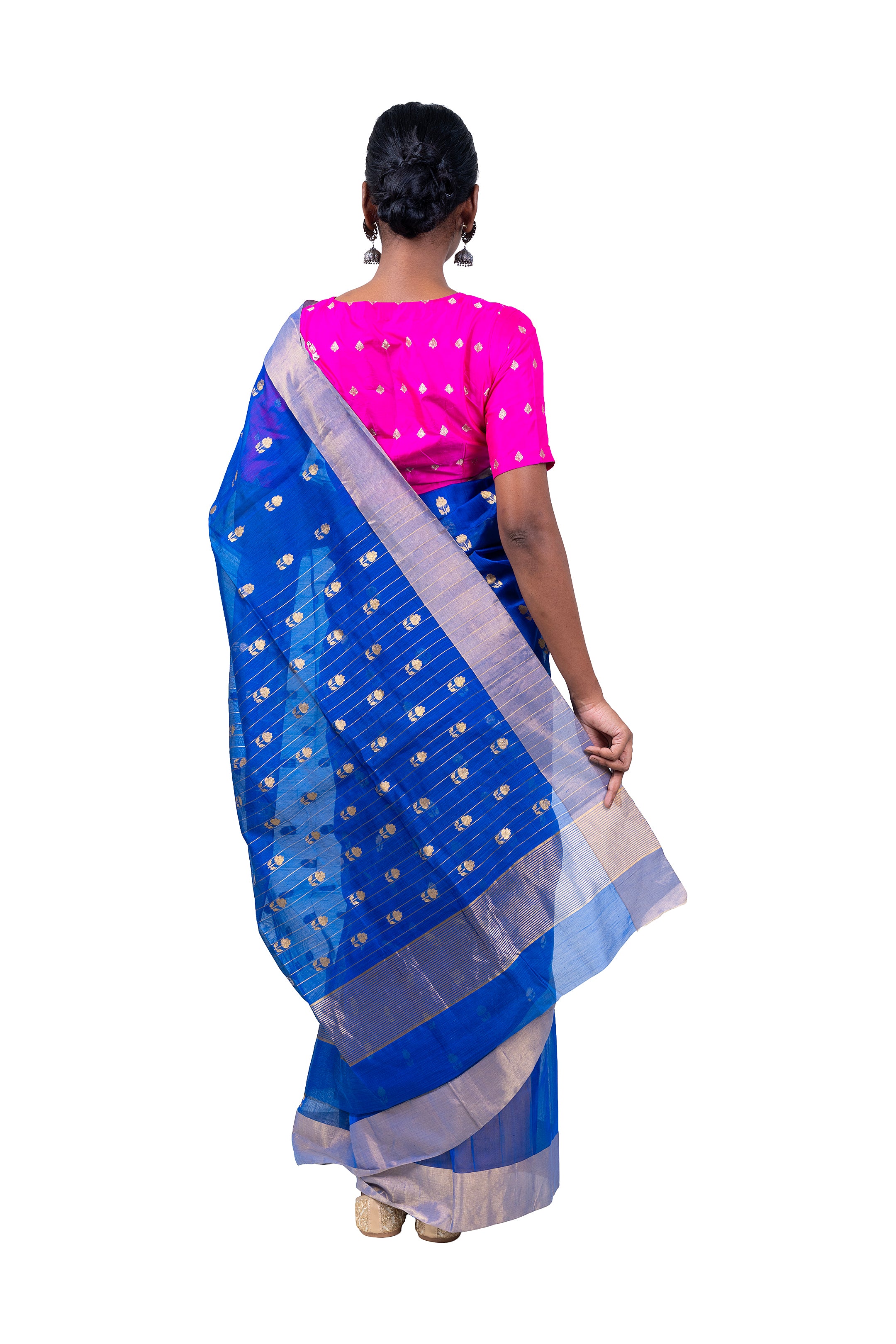 Woman wearing a blue saree with a white border on a white background