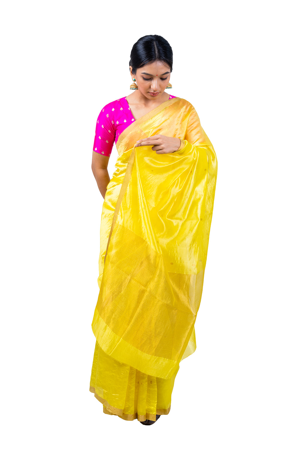 Woman wearing a yellow saree with a pink blouse on a white background
