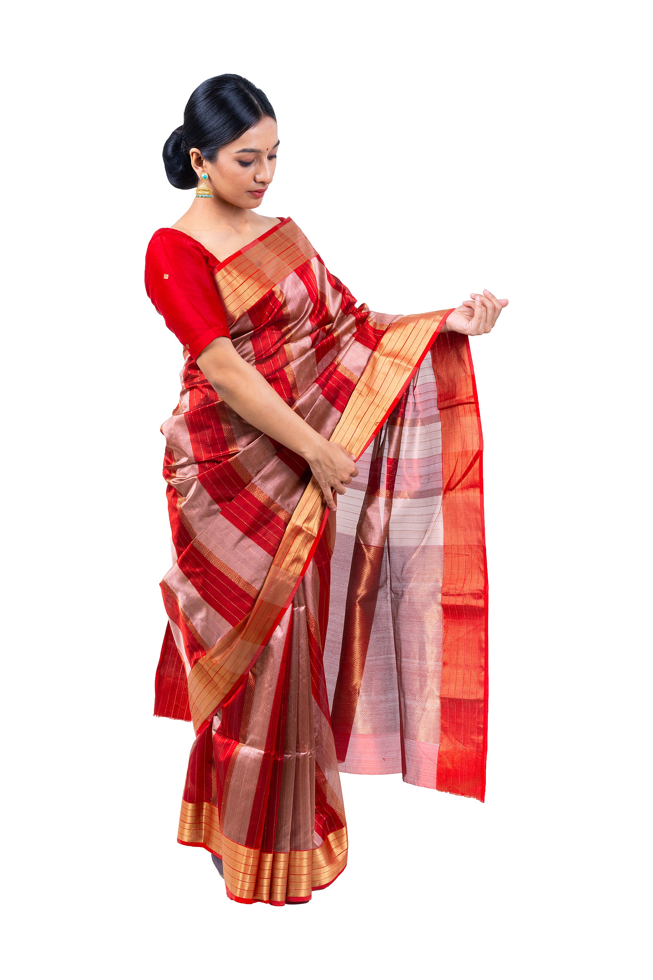Woman wearing a red and gold saree on a white background
