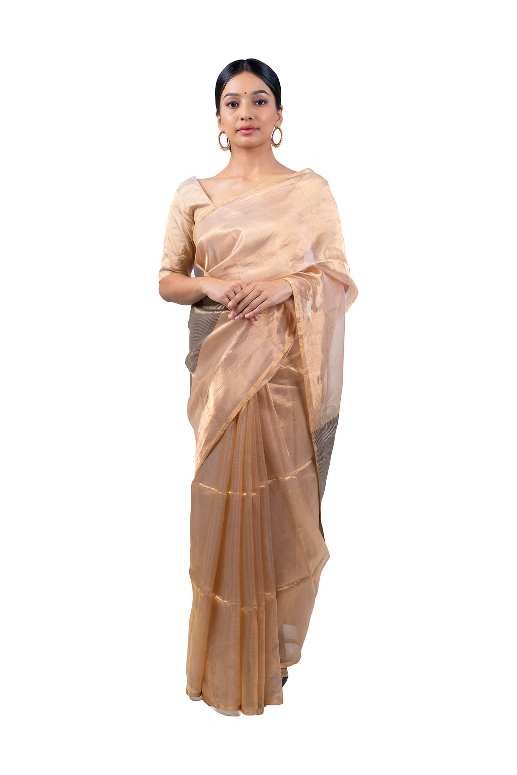 Woman wearing a beige saree with a white background