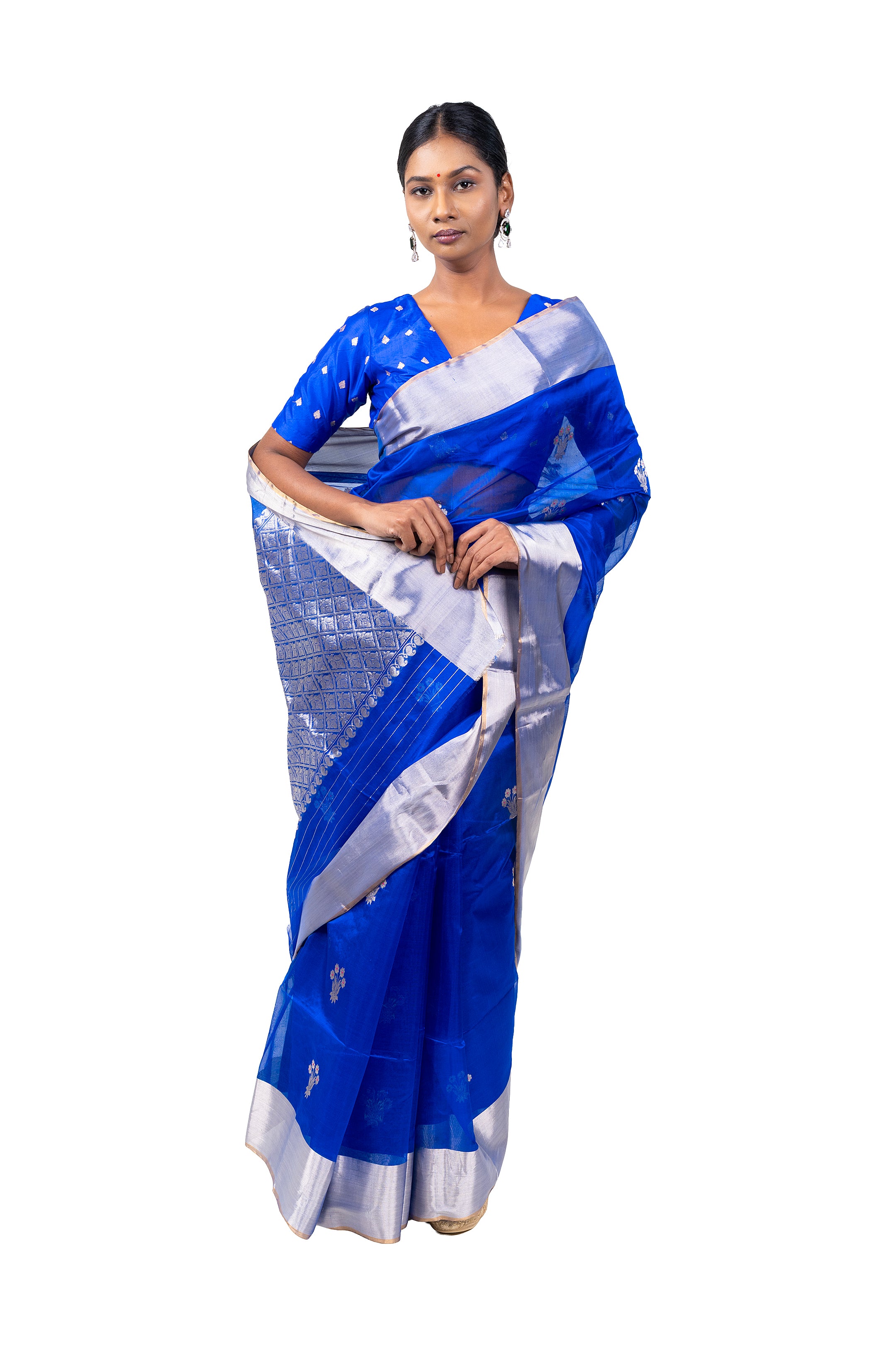 Woman wearing a blue and white saree on a white background