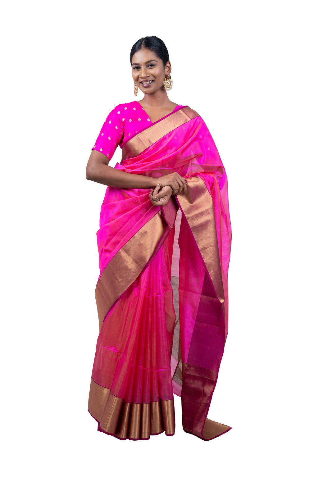 Woman wearing a pink saree with a gold border on a white background