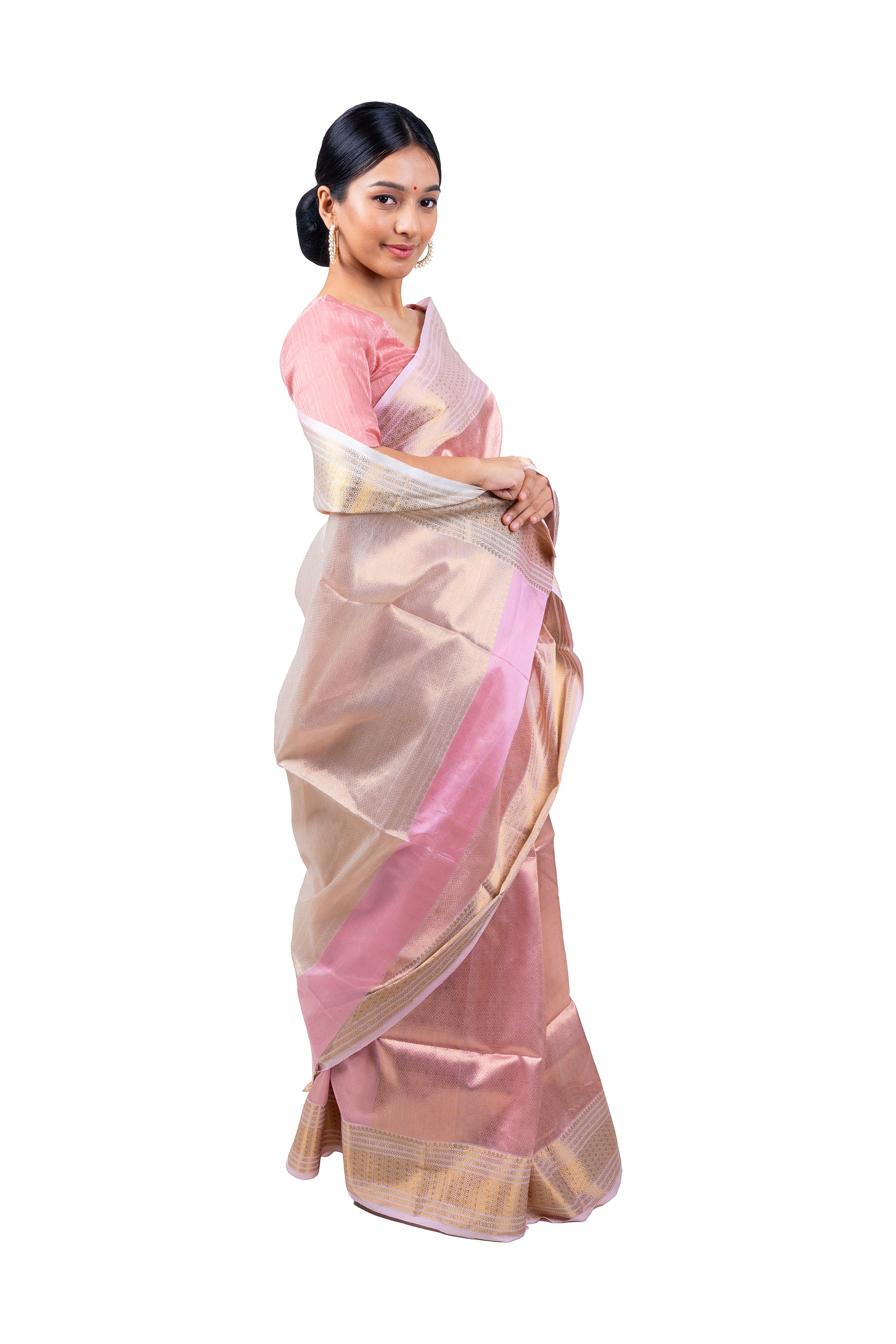 Woman wearing a pink and beige saree on a white background