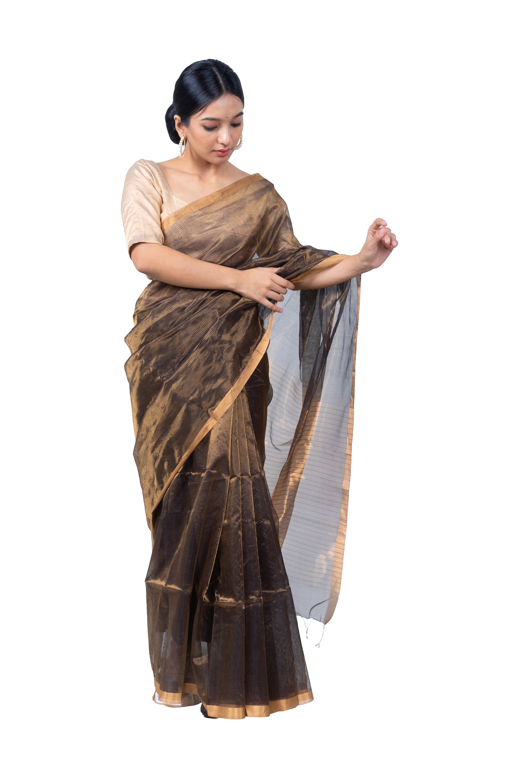 Woman wearing a brown saree with a white background