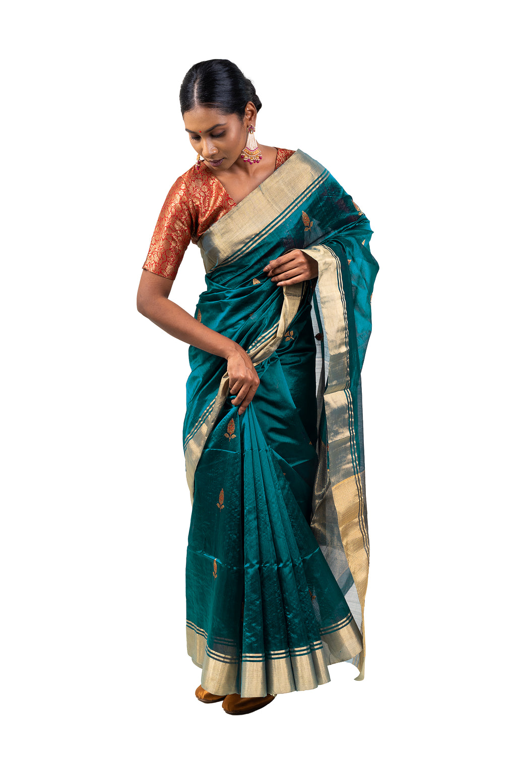 Woman wearing a teal saree with a white blouse on a white background