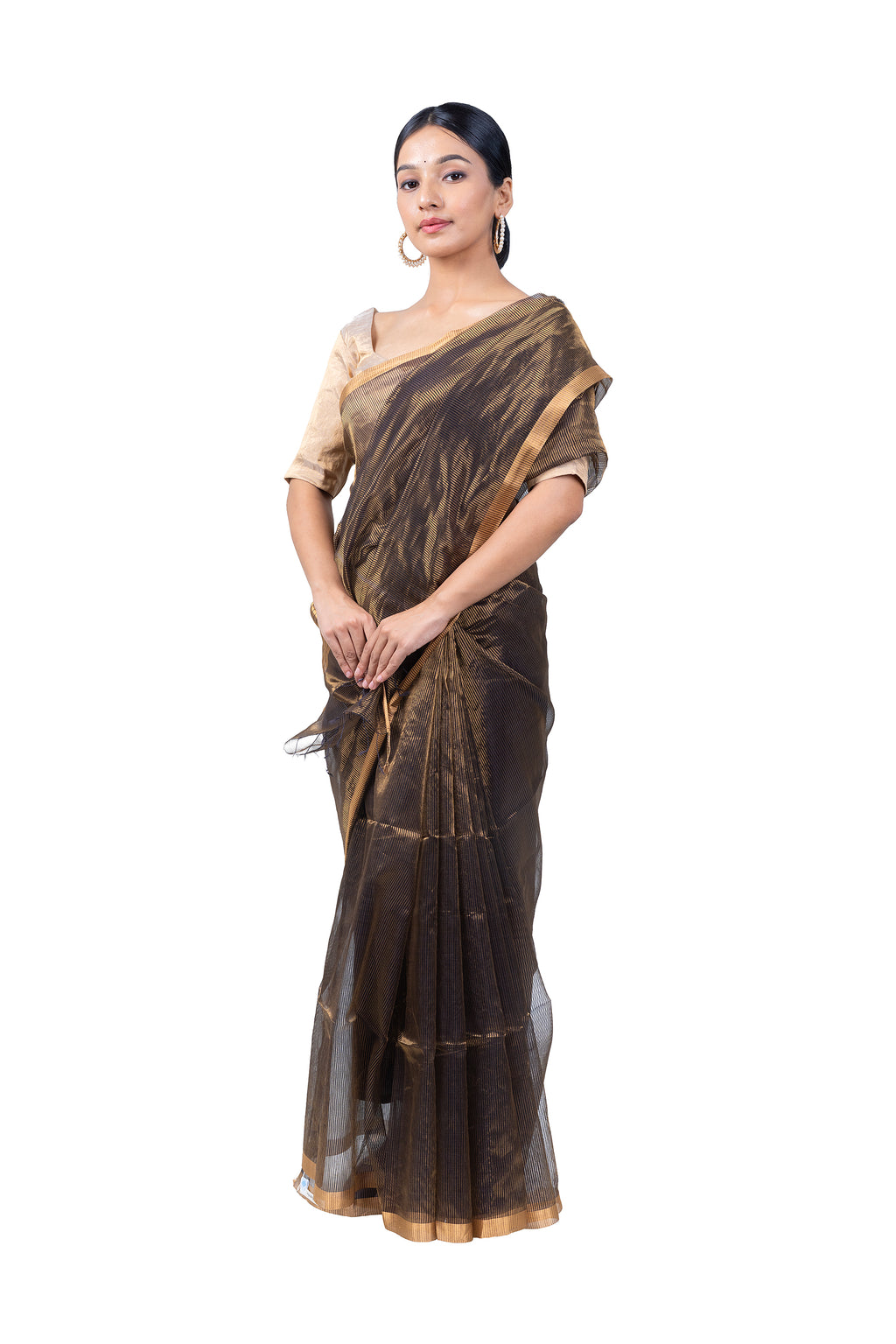 Woman wearing a brown saree with a white background
