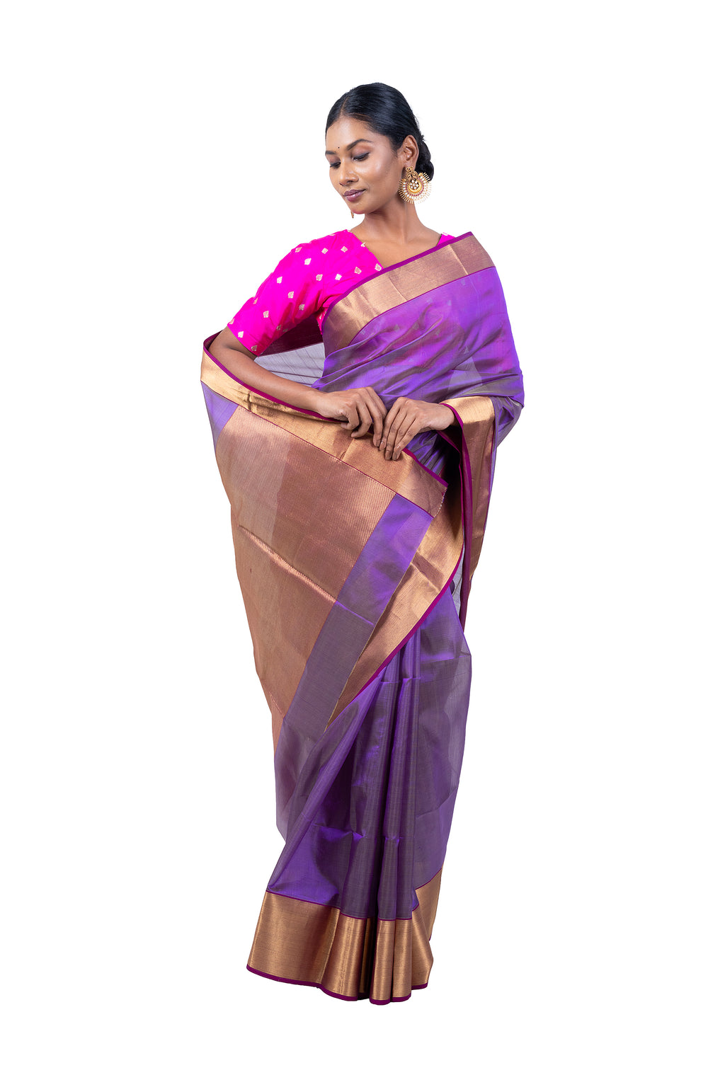 Woman wearing a purple and gold saree on a white background