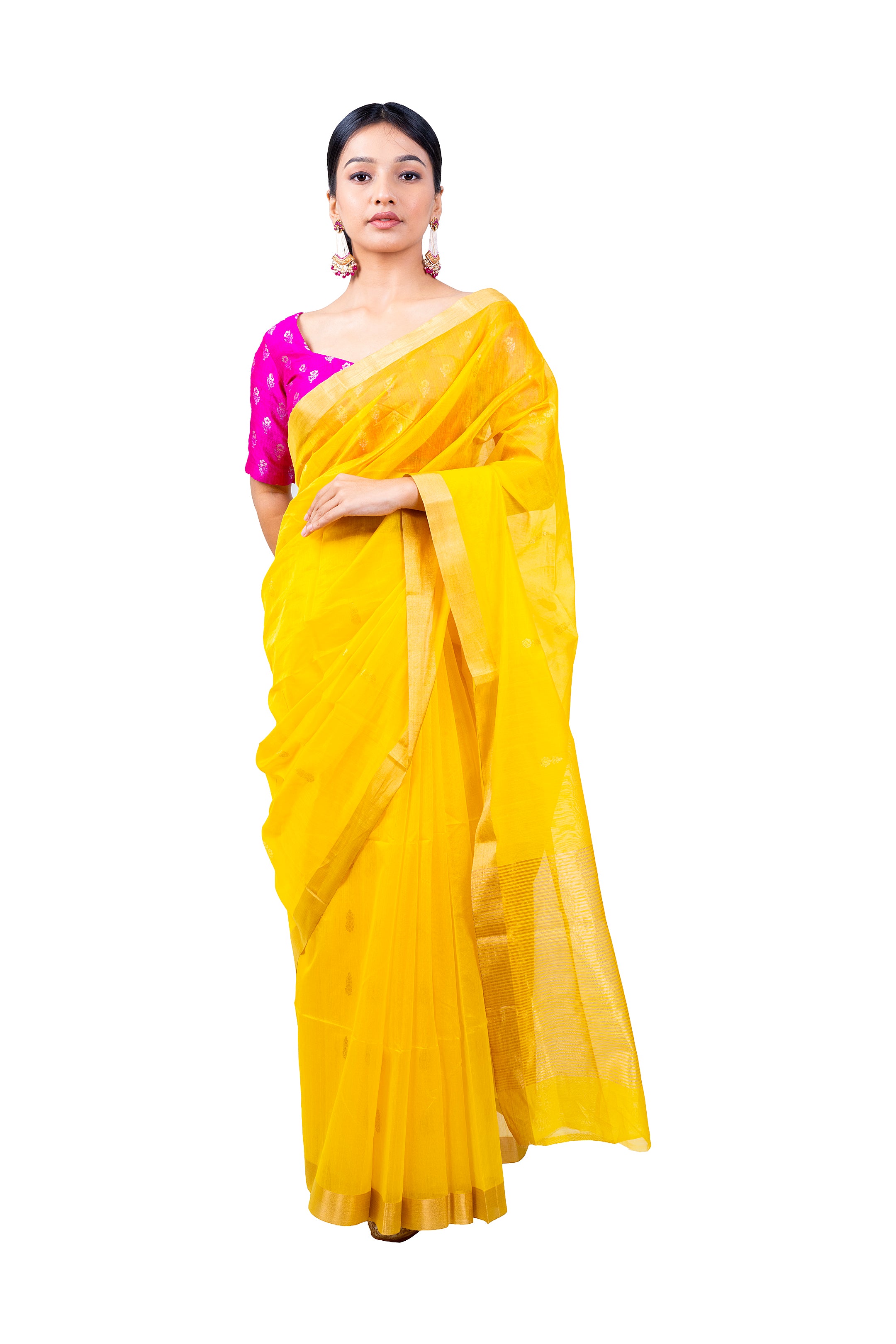 Woman wearing a yellow saree with a pink blouse on a white background