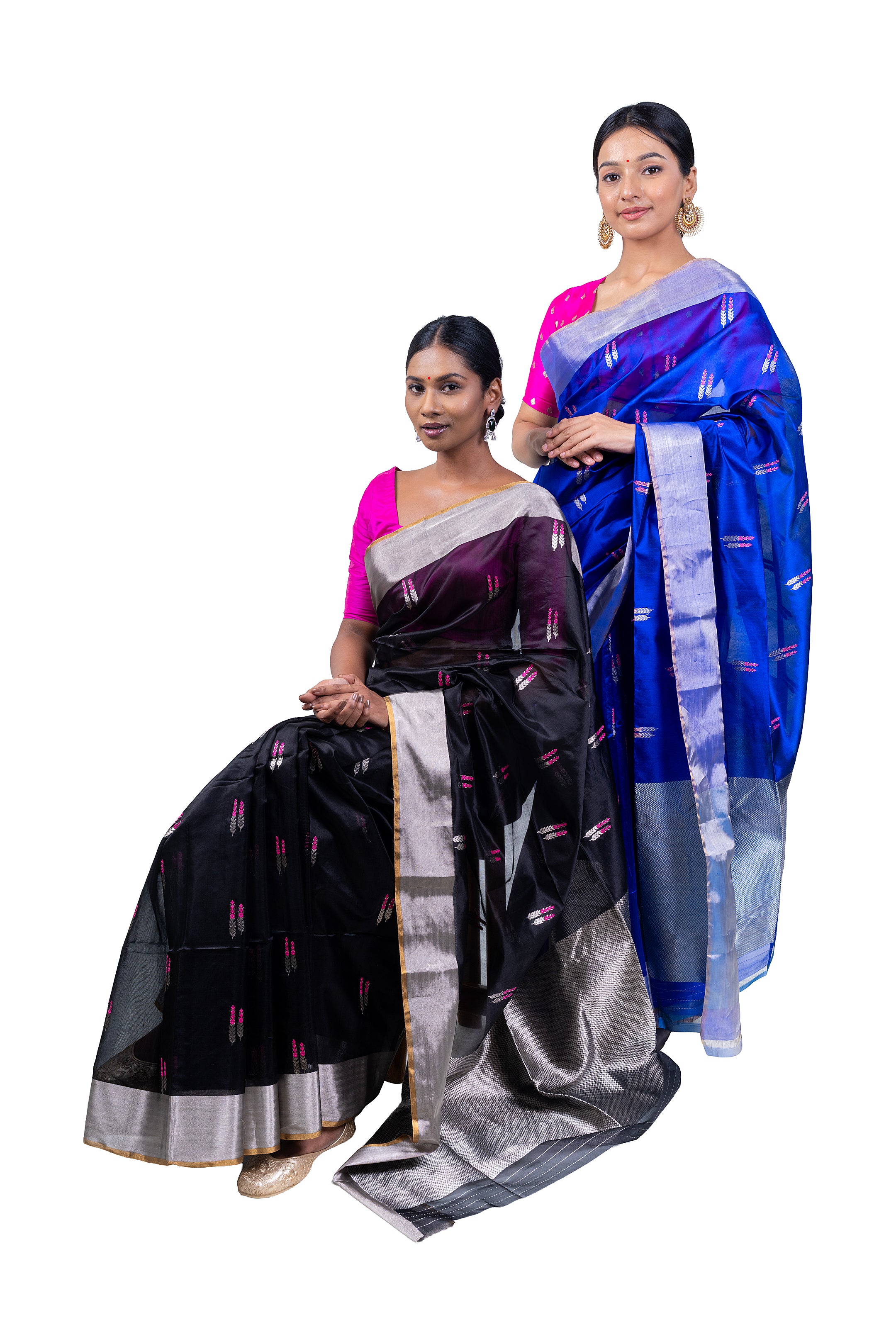 Two women wearing sarees on a white background