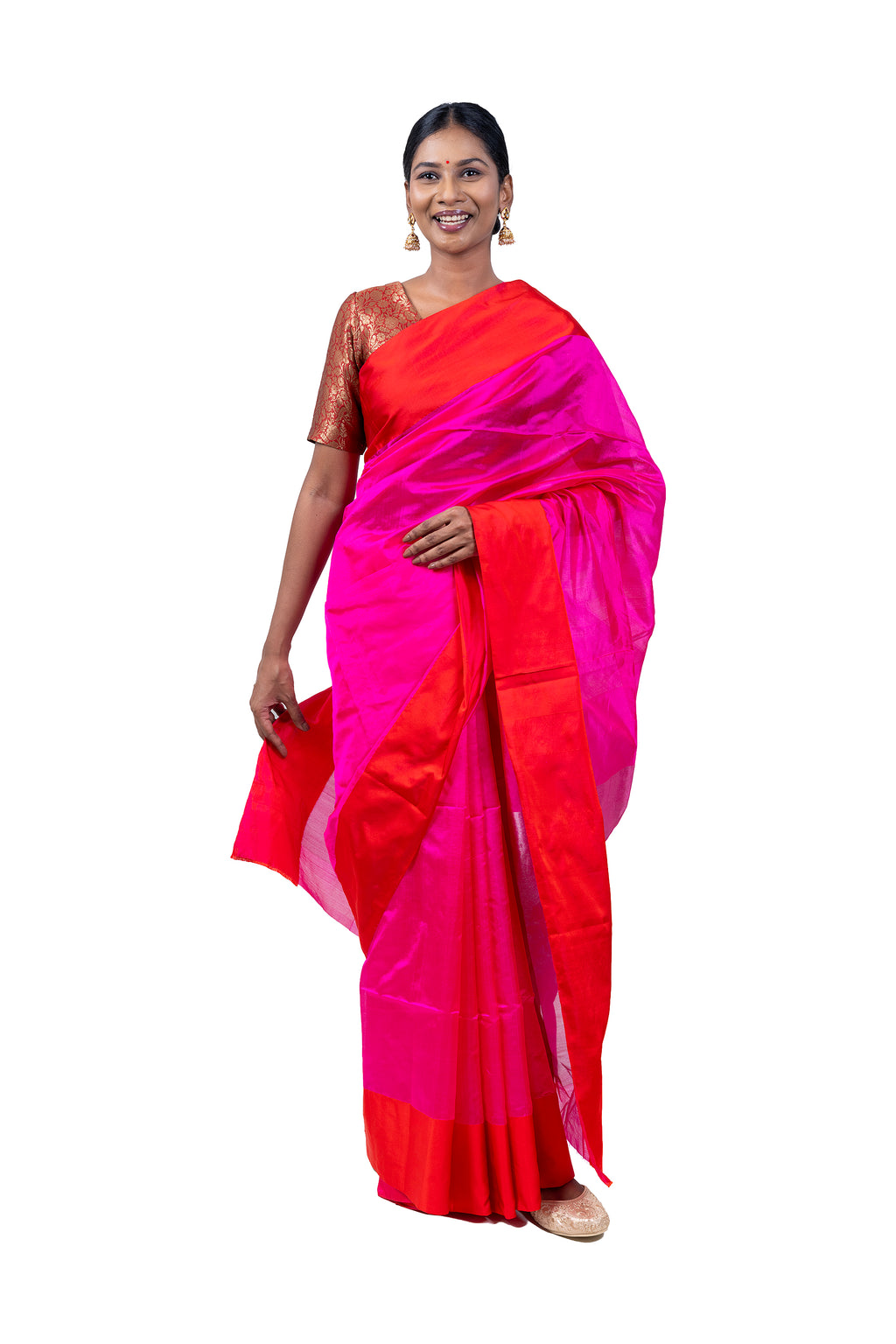 Woman wearing a bright pink and orange saree on a white background