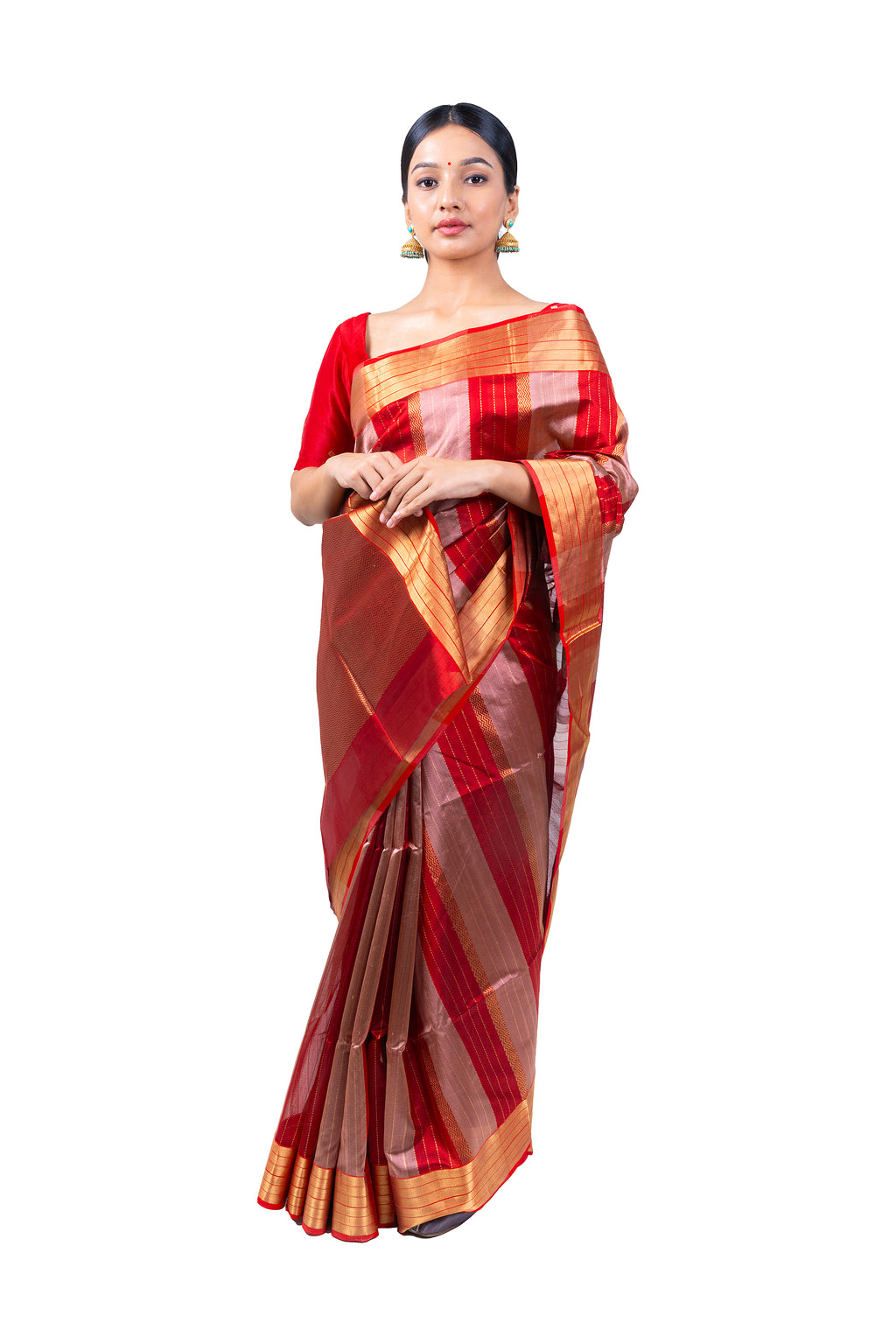 Woman wearing a red and gold saree on a white background