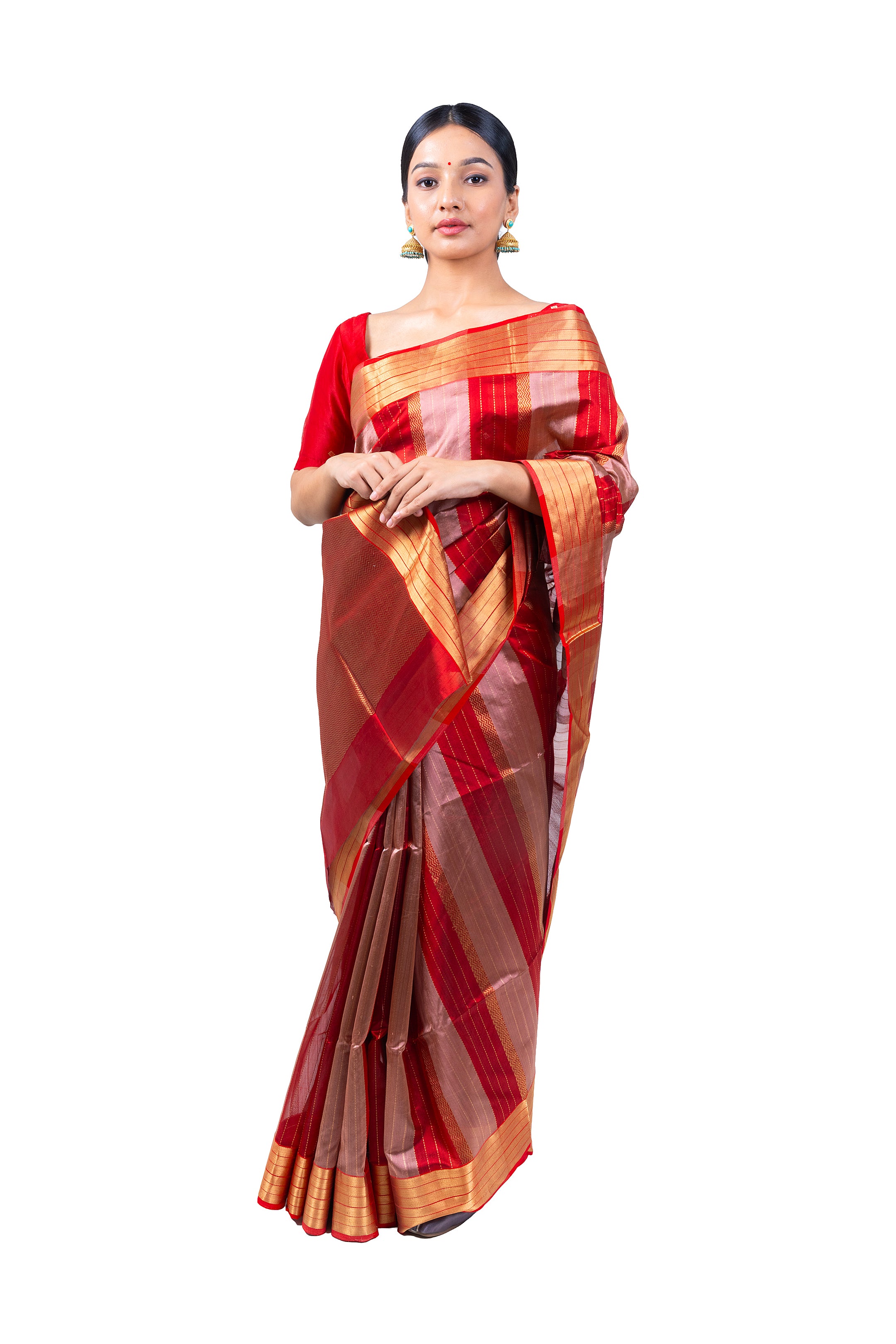Woman wearing a red and gold saree on a white background