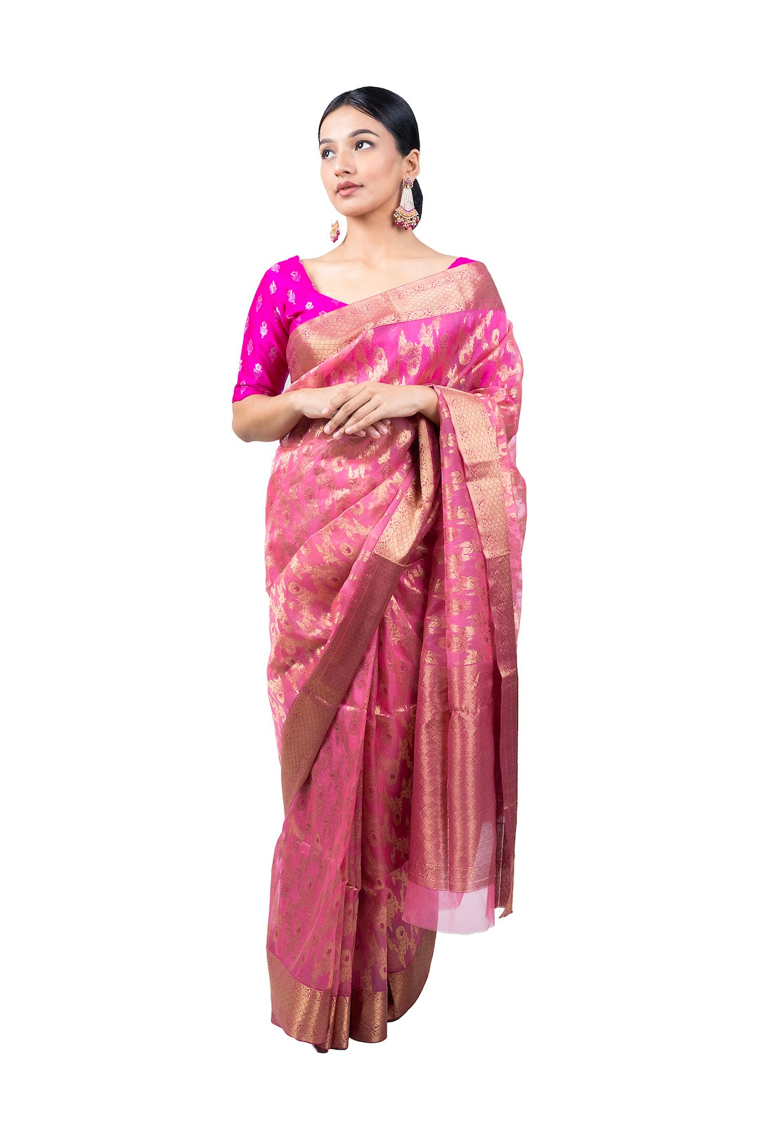 Woman wearing a pink saree with a white background