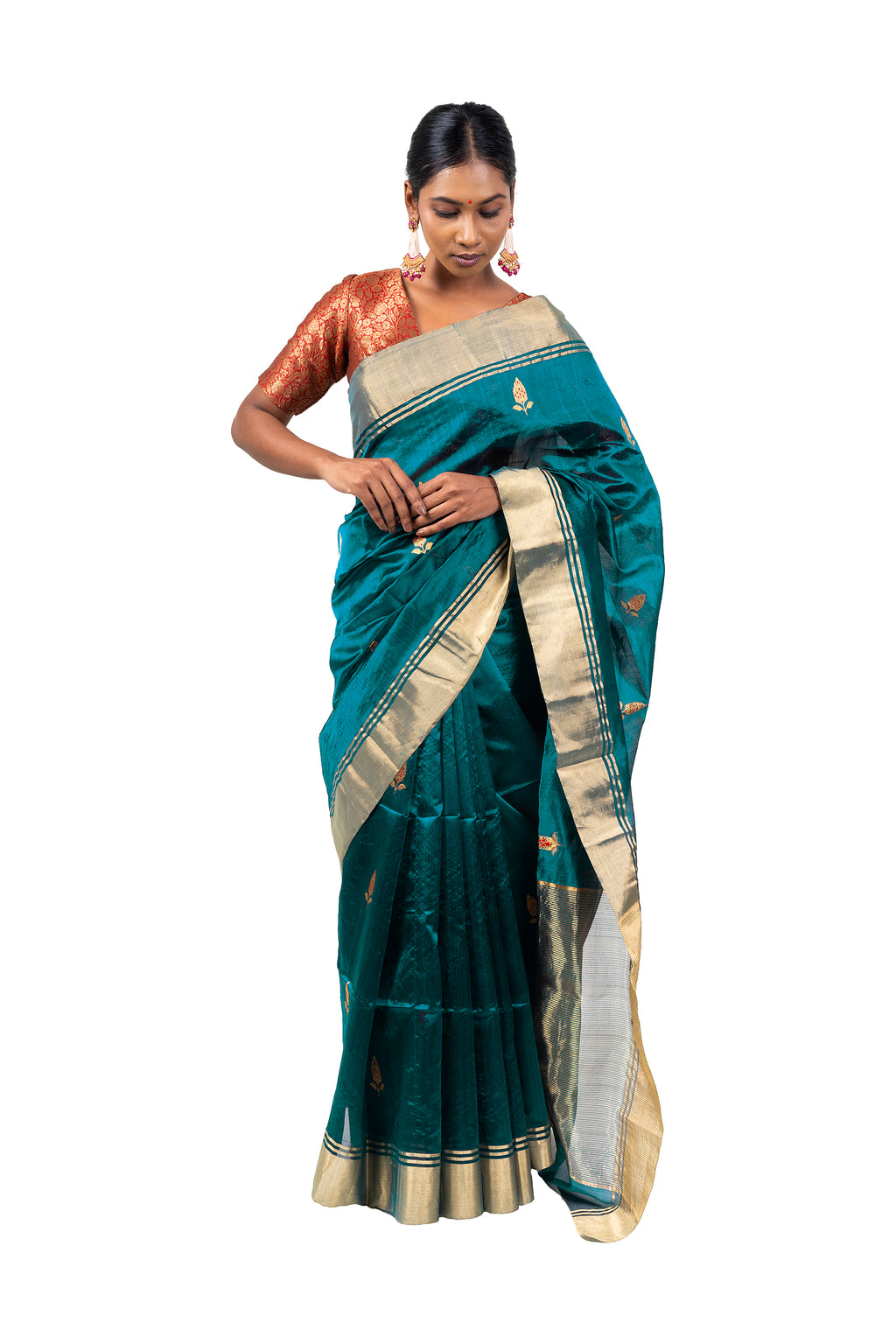 Woman wearing a teal saree with gold border on a white background