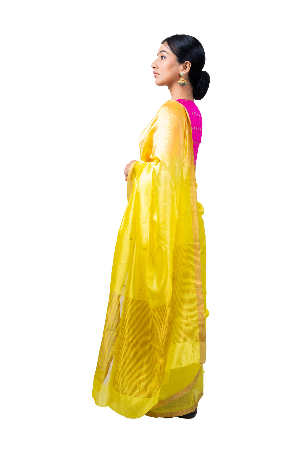 Woman wearing a yellow saree with a pink blouse on a white background